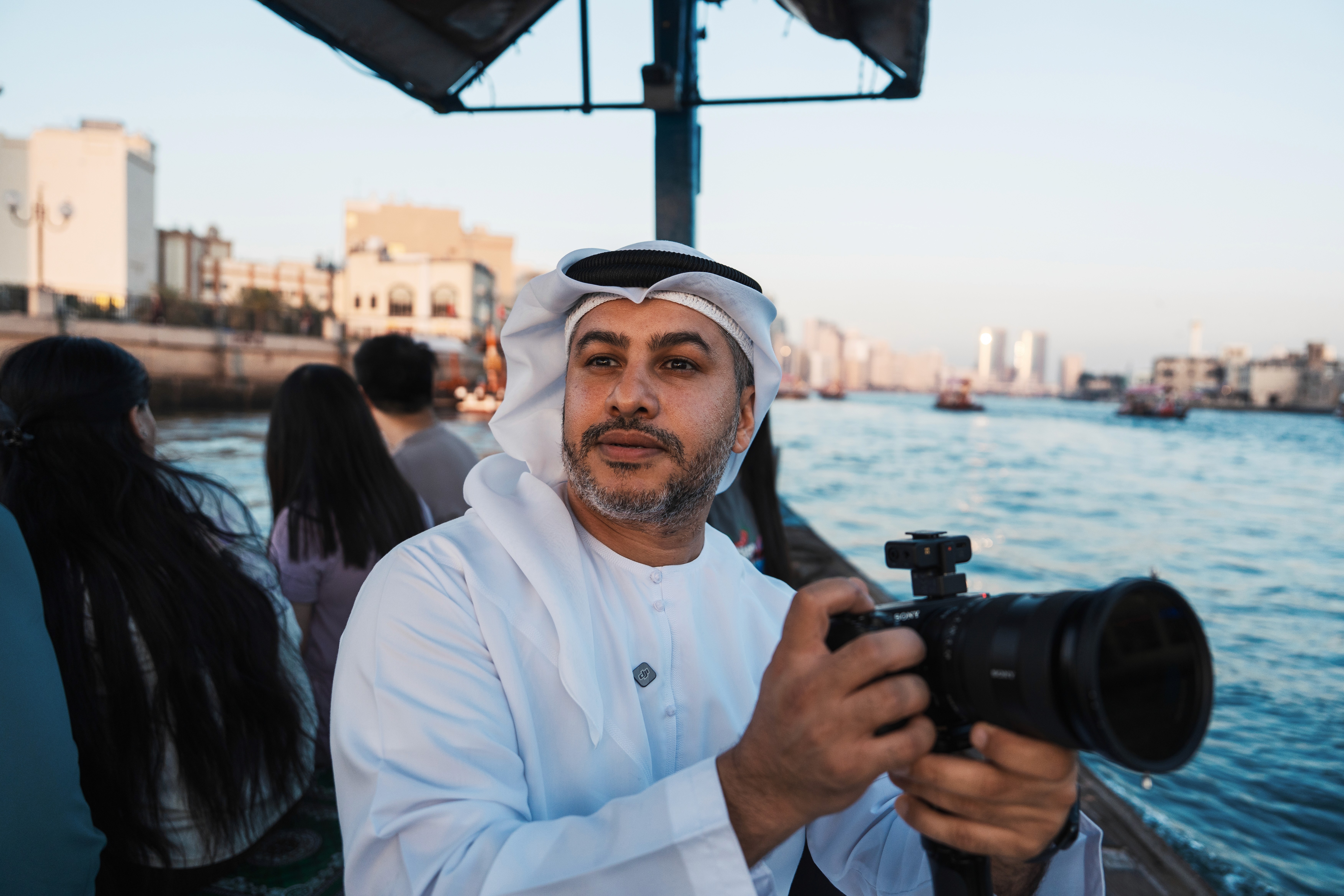 Feed Kiani holding camera