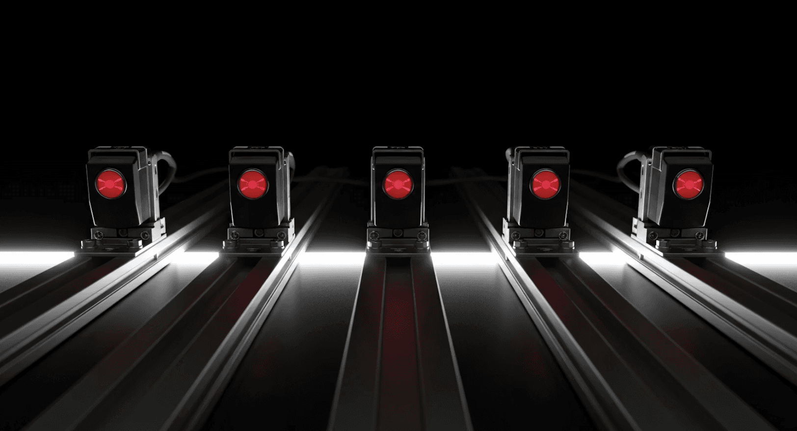 metal machines with red light in the middle