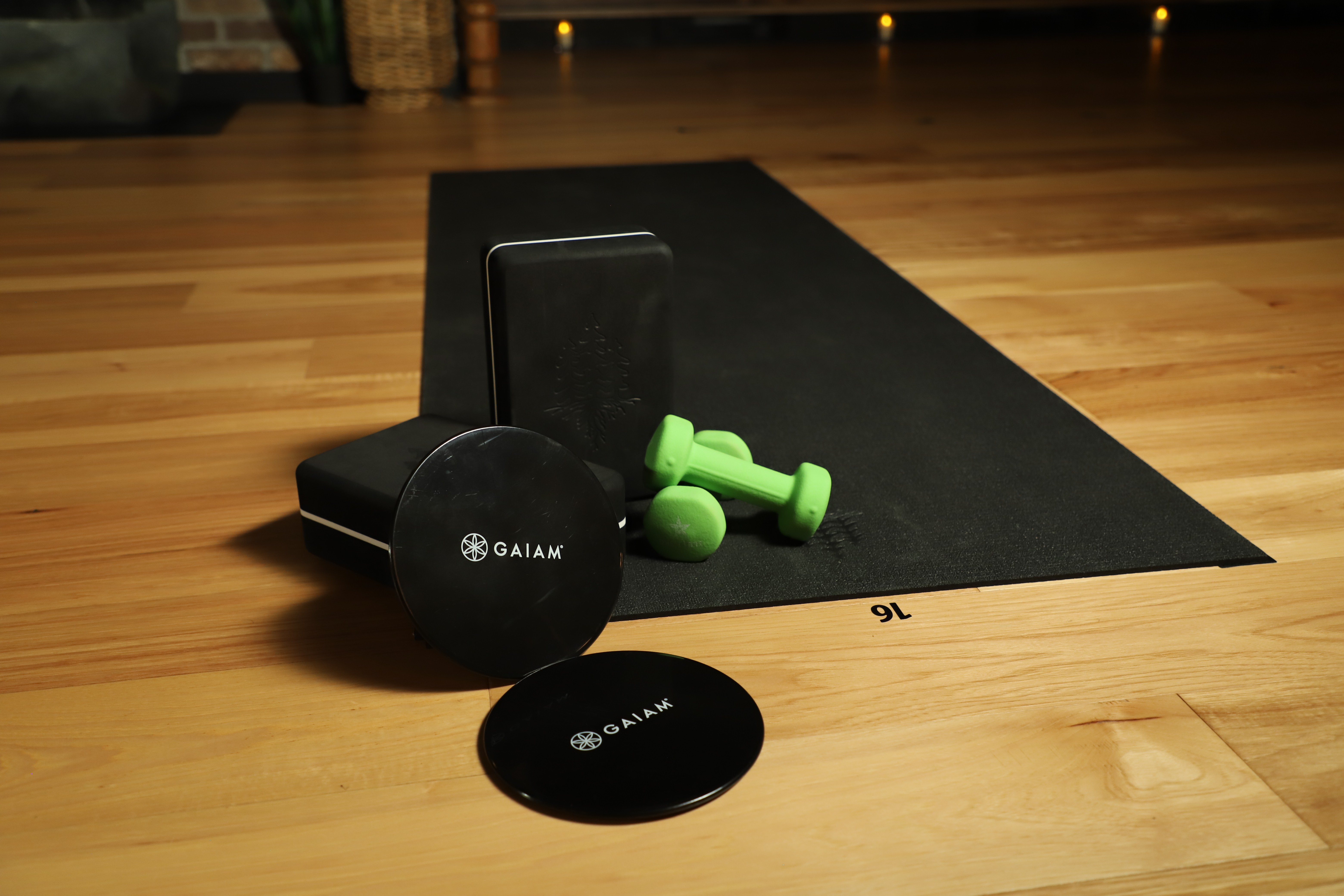 yoga mat, weights, yoga blocks, and sliders