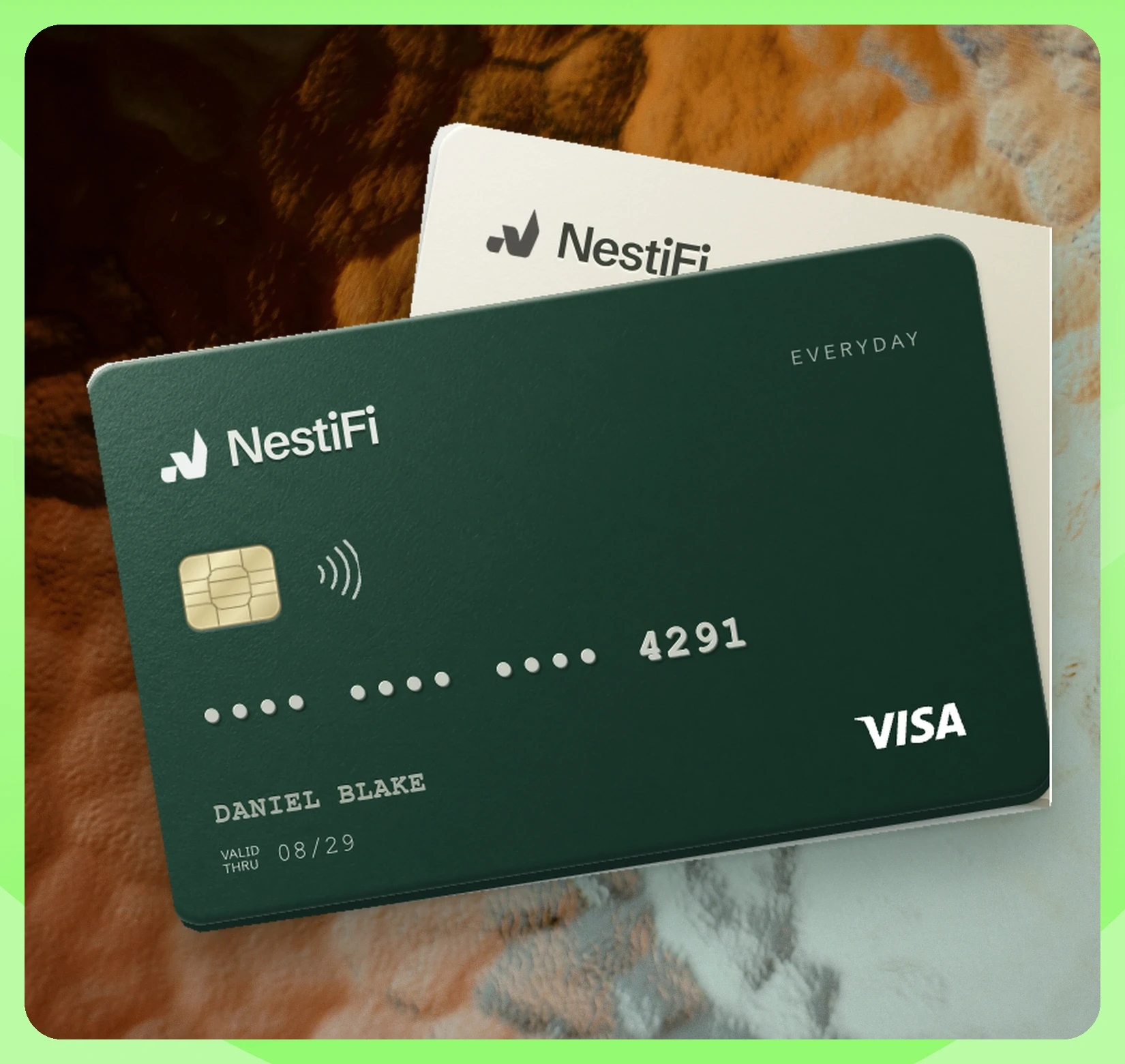 The genuine NestiFi demonstration card artwork, shown on a photographic background