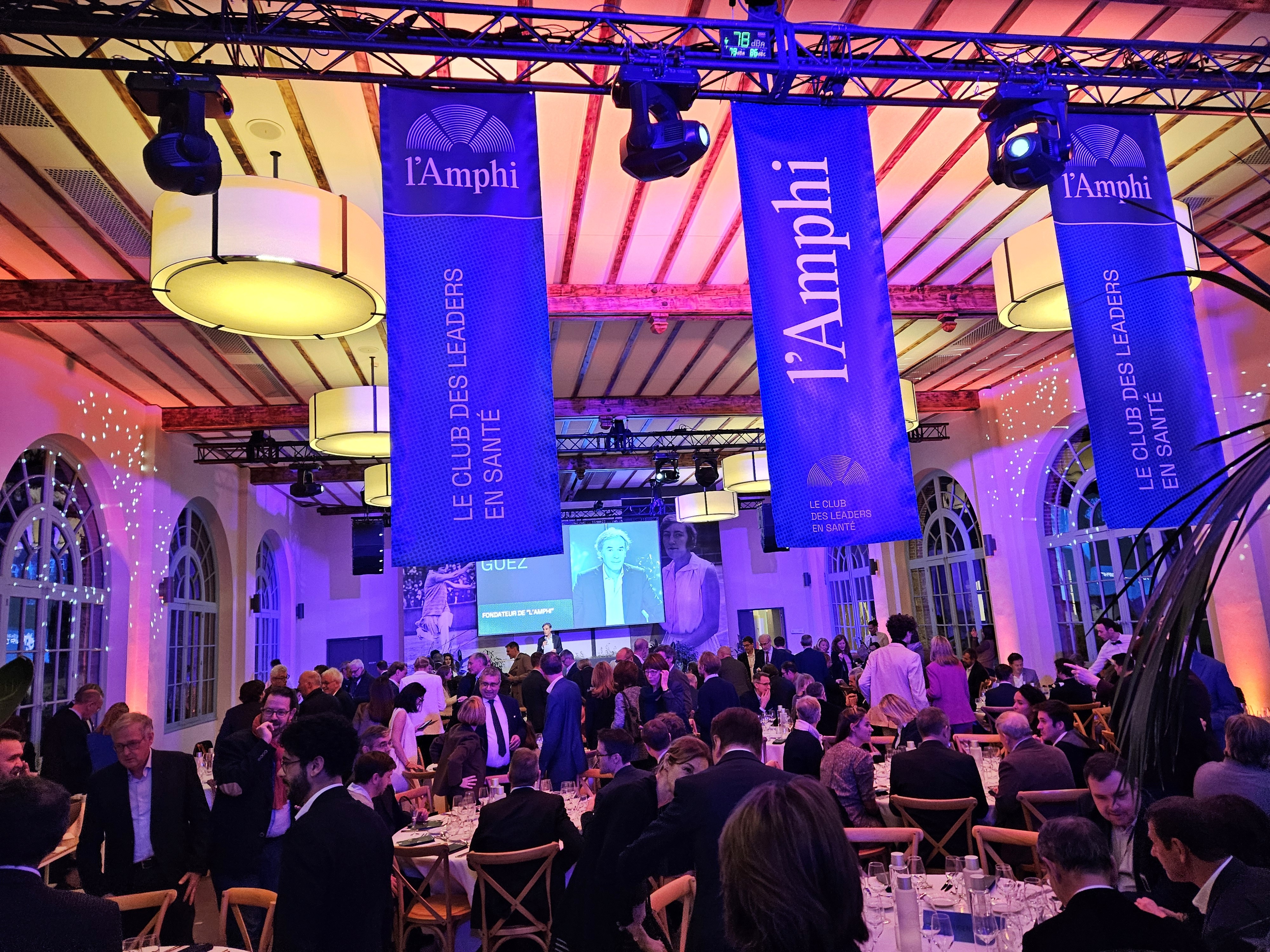 The audience listens to the conference