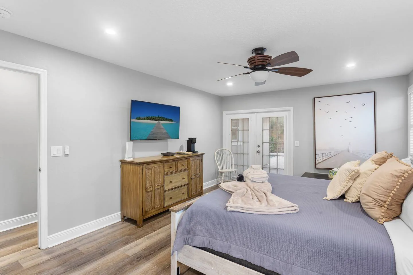 Master bedroom with king and French doors to outside at Sarasota Beach Bungalow, Bradenton, Florida