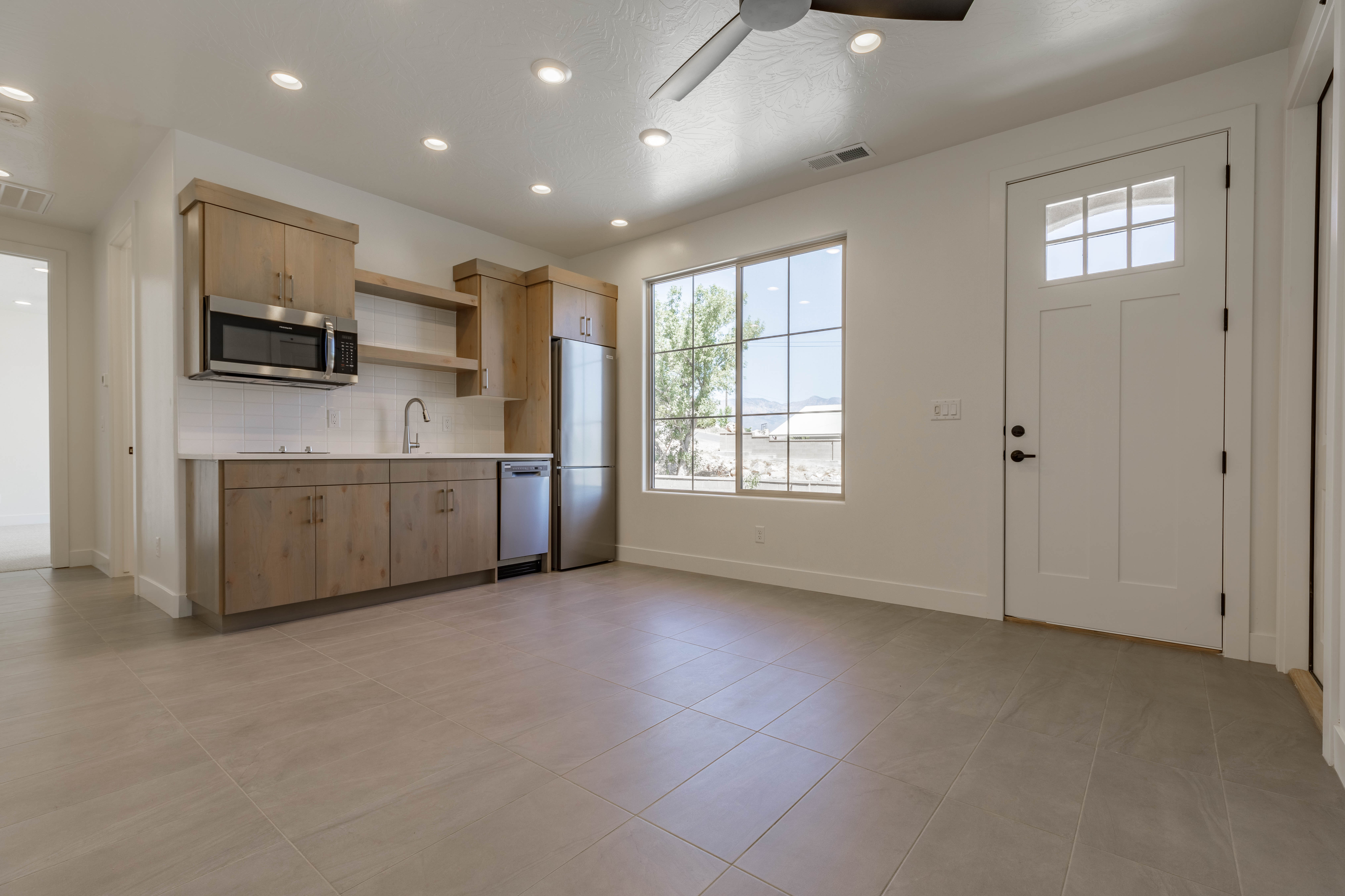 Casita kitchen at Mountain View’s Cove featuring wood cabinetry and a compact, functional layout in Hurricane, Utah.