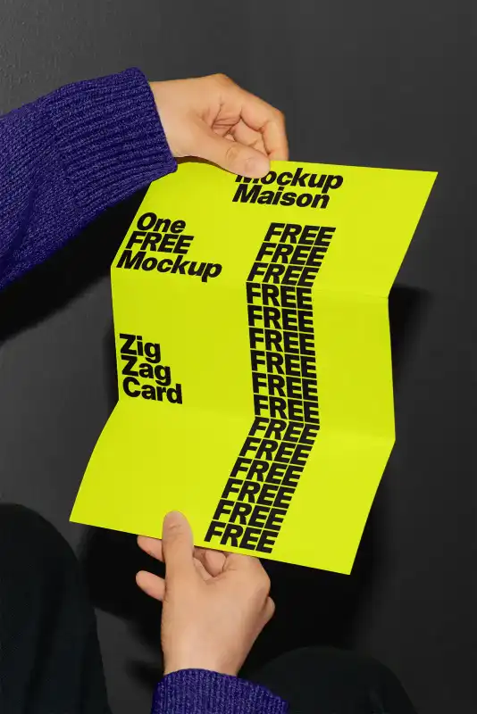 Zigzag card mockup in a vibrant blue design, held by two hands against a gray background. The foldable format showcases a clean, modern layout ideal for creative presentations.