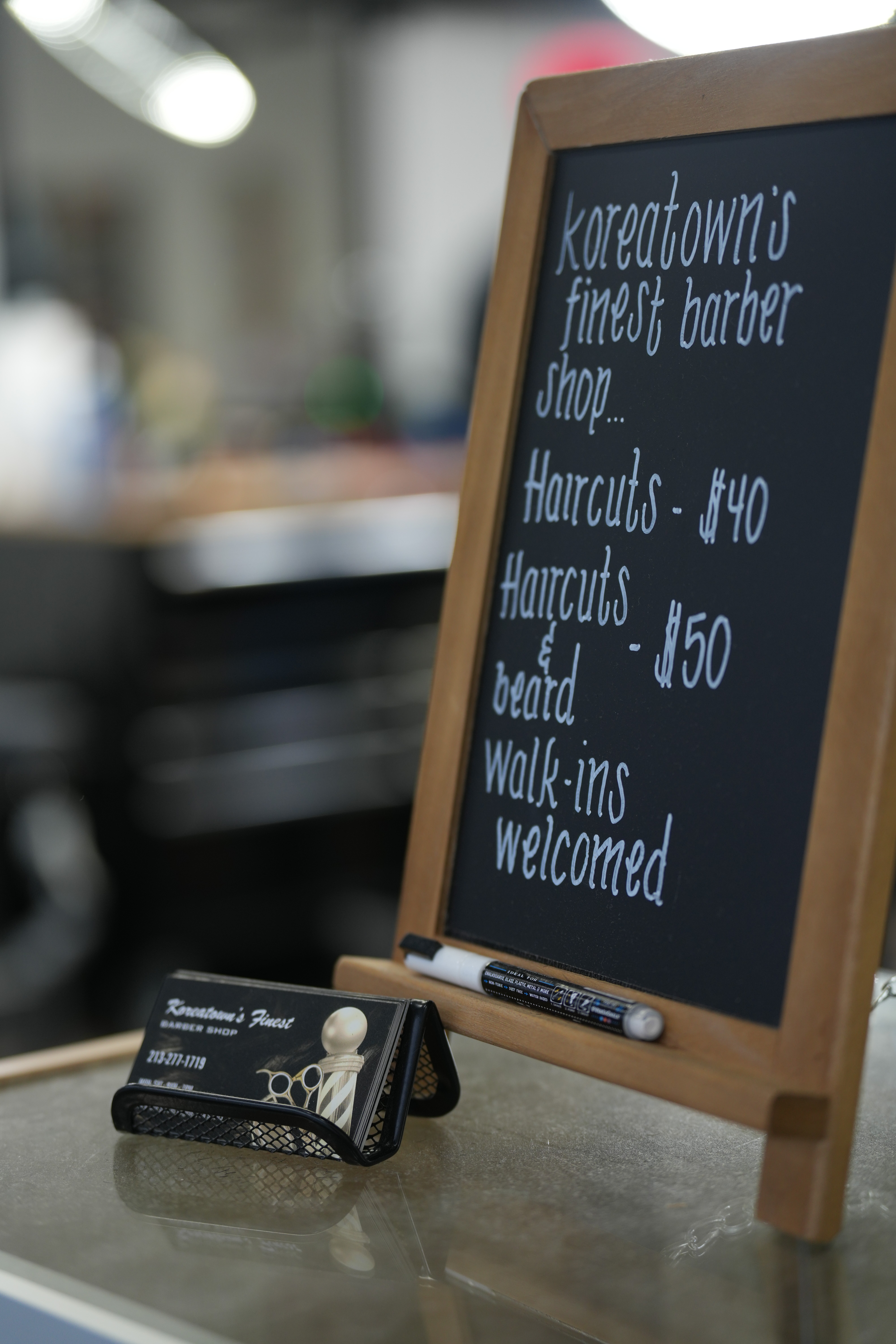 Chalk board of services offered by the barbershop. 