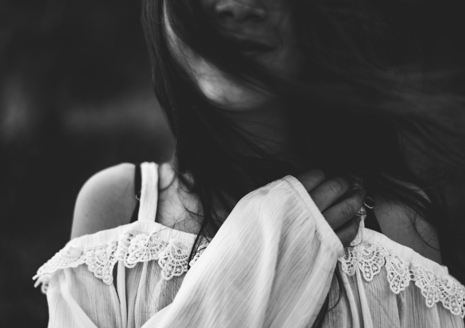 Black and white photo of a smiling woman