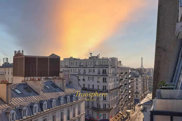 A serene backyard with a pool, sun loungers, and olive trees, set against a warm, sunny landscape.