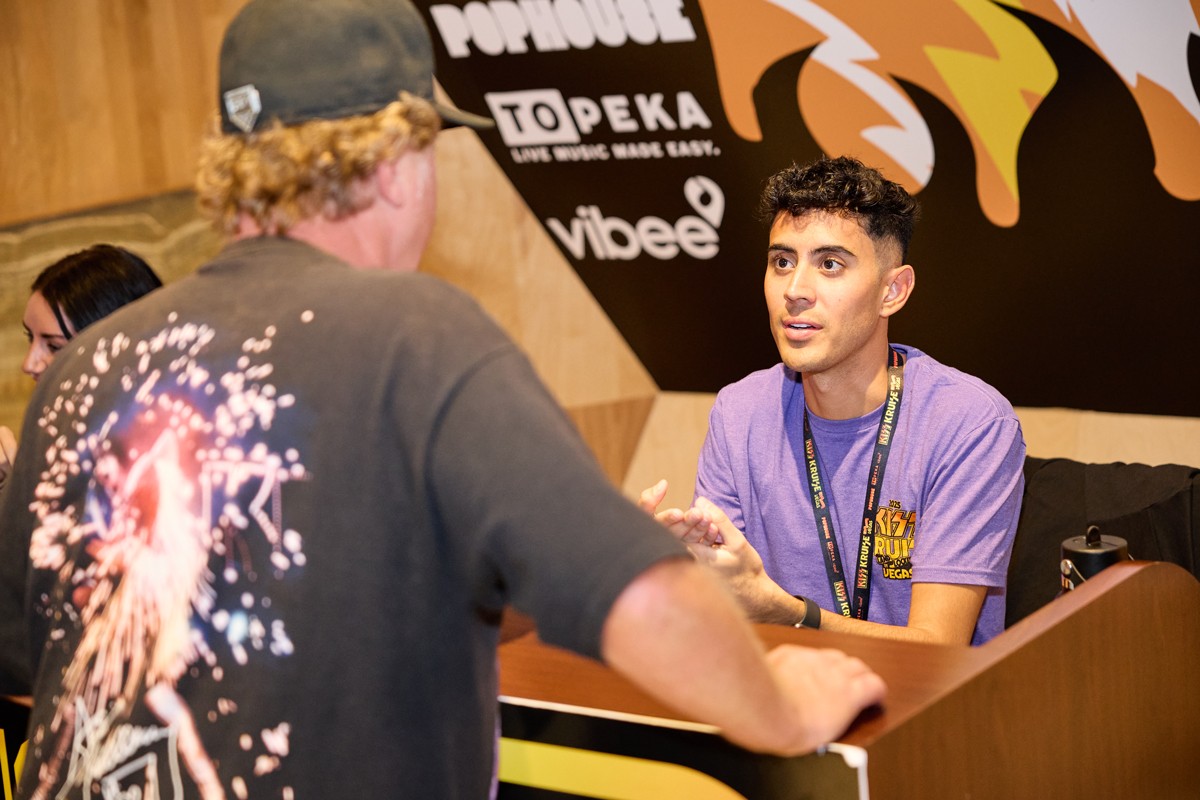 Representative speaking with a guest