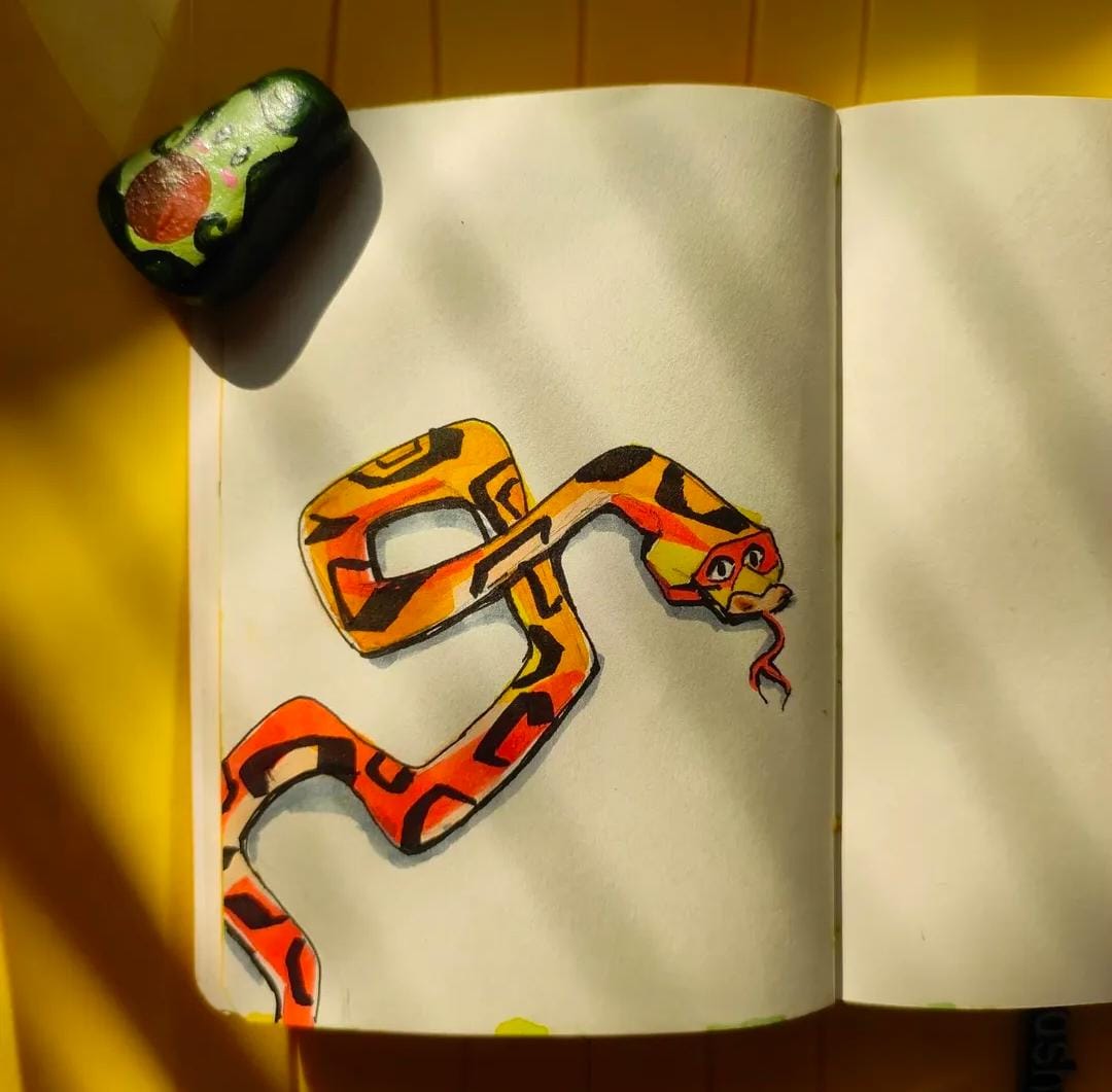 A bottle of daisy perfume with floral accents.