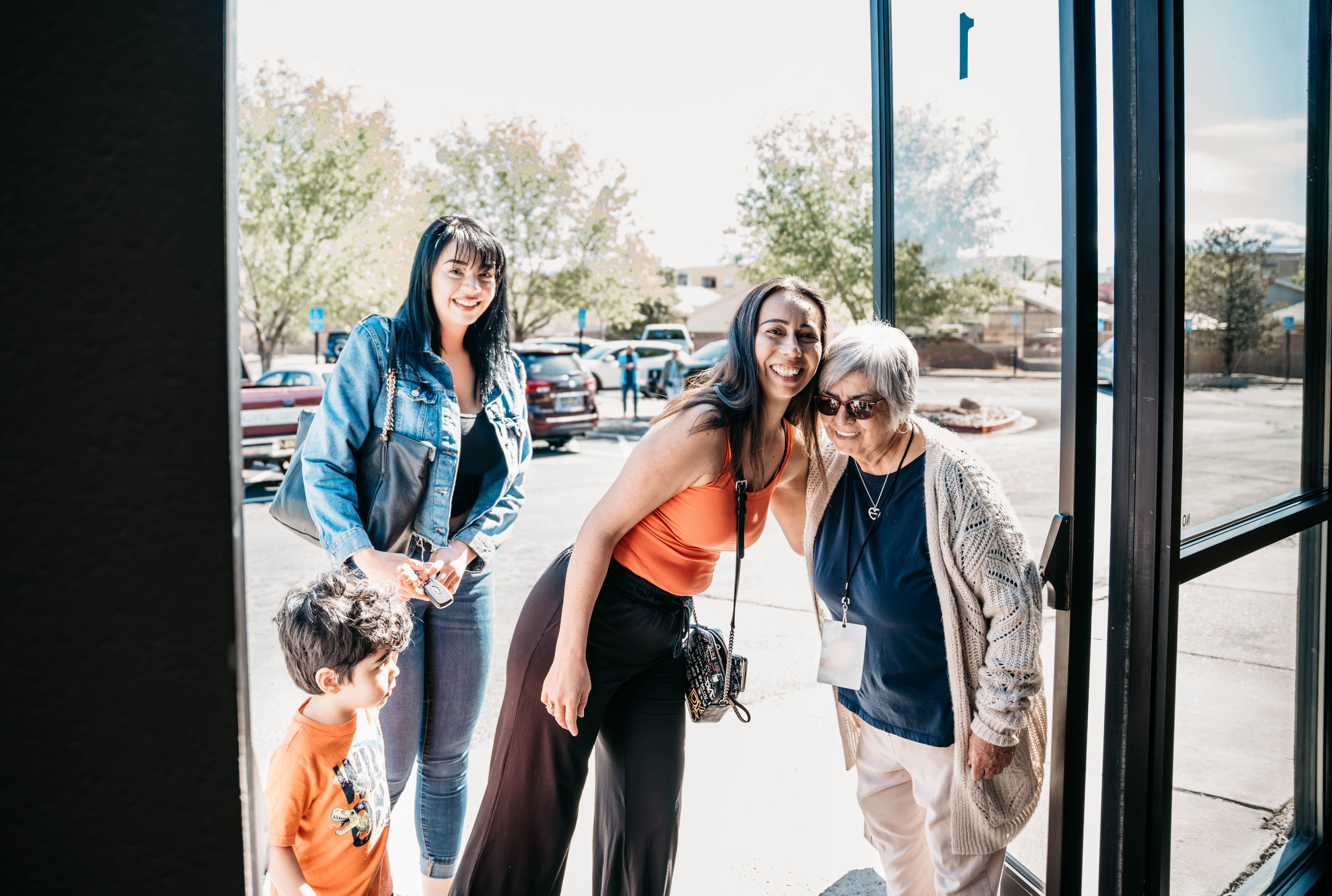 Women entering church hugging