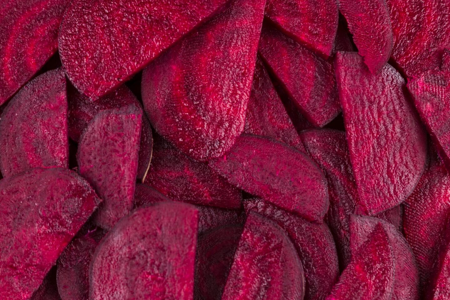 two people looking at a tablet and smiling