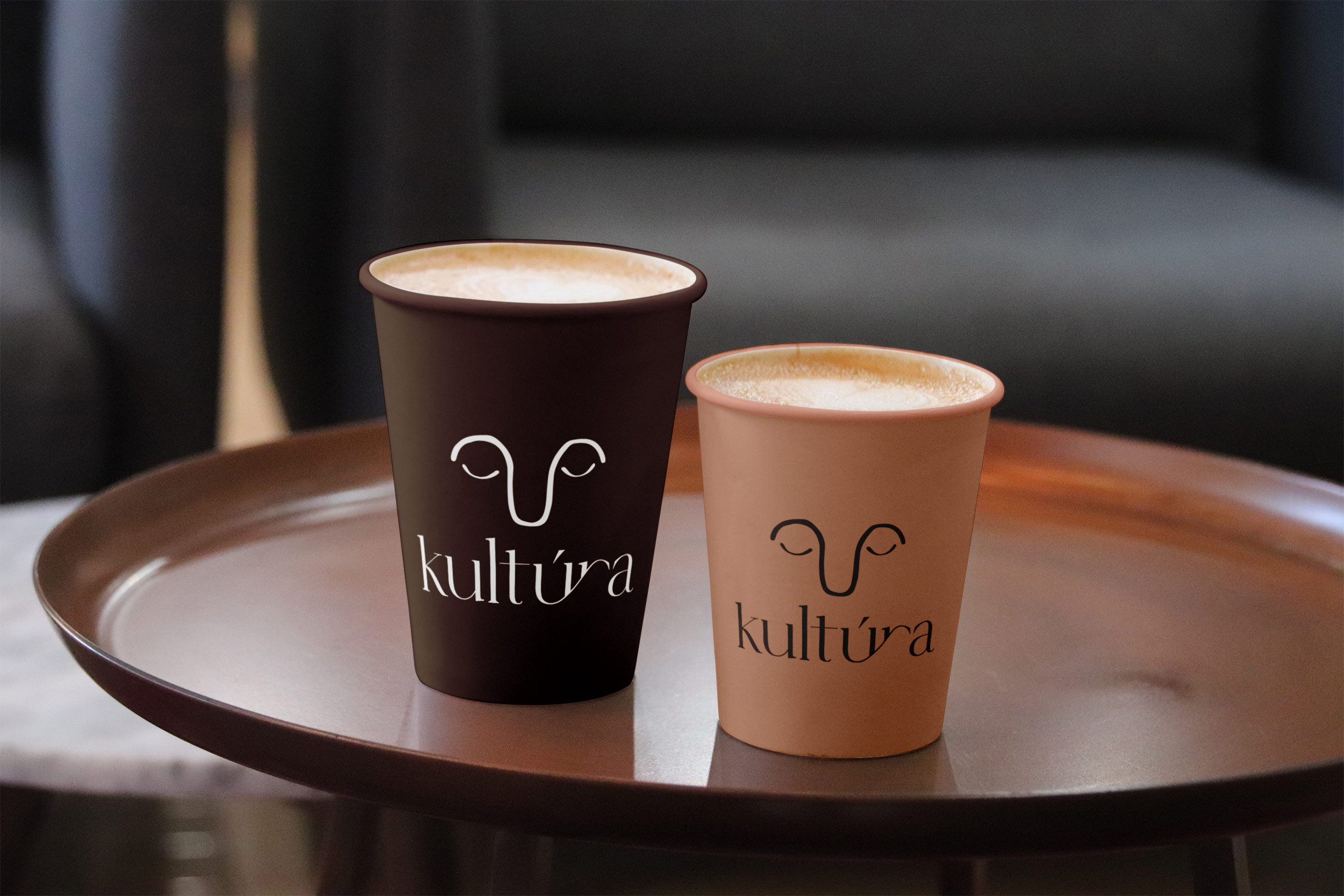 A minimal 3D arrangement of pastel geometric shapes, including pink, purple, and blue cubes with varied textures and a smooth pink sphere, displayed on a clean white background.