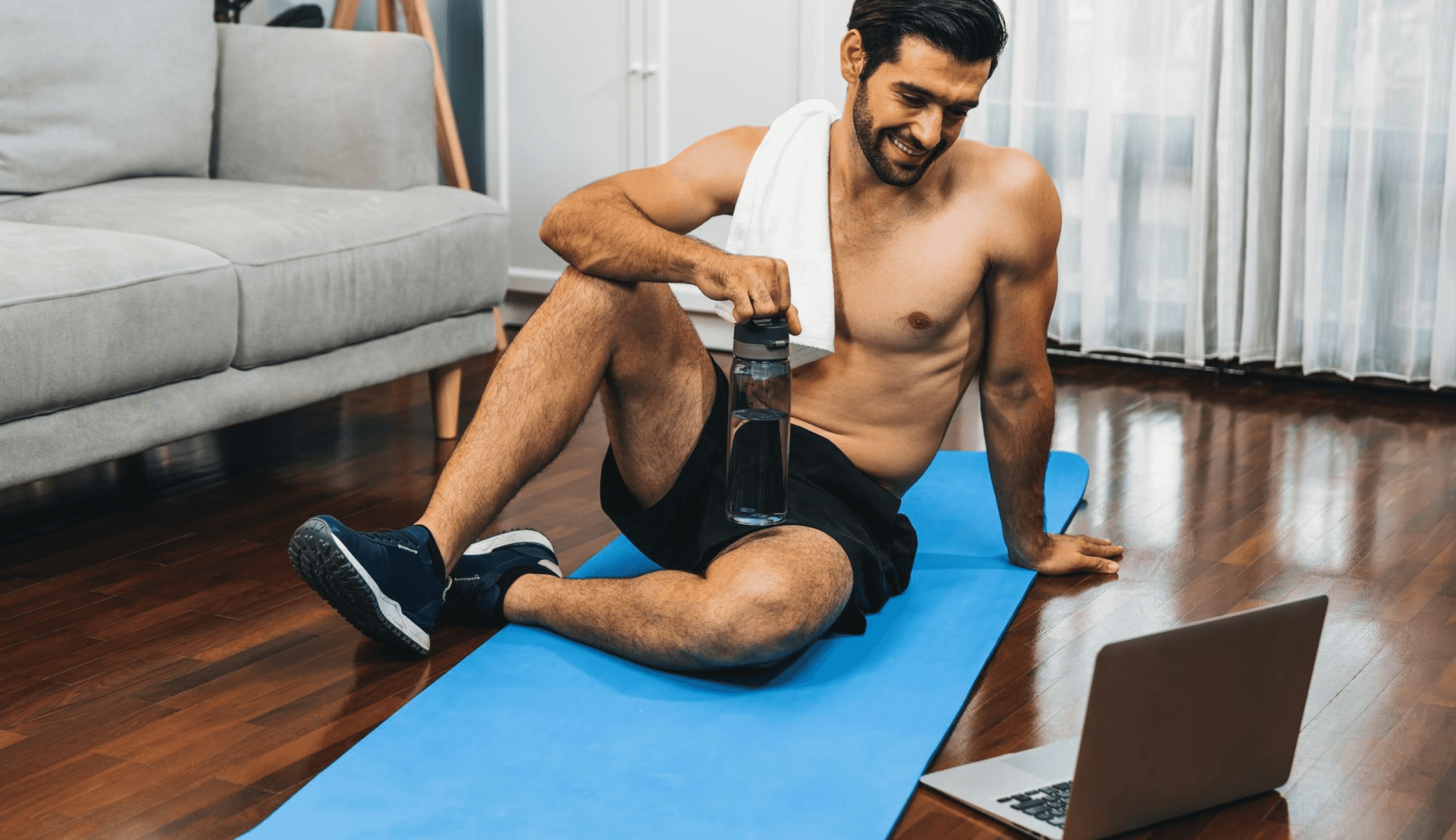 Man engaging in online fitness with Coach Derek Miles
