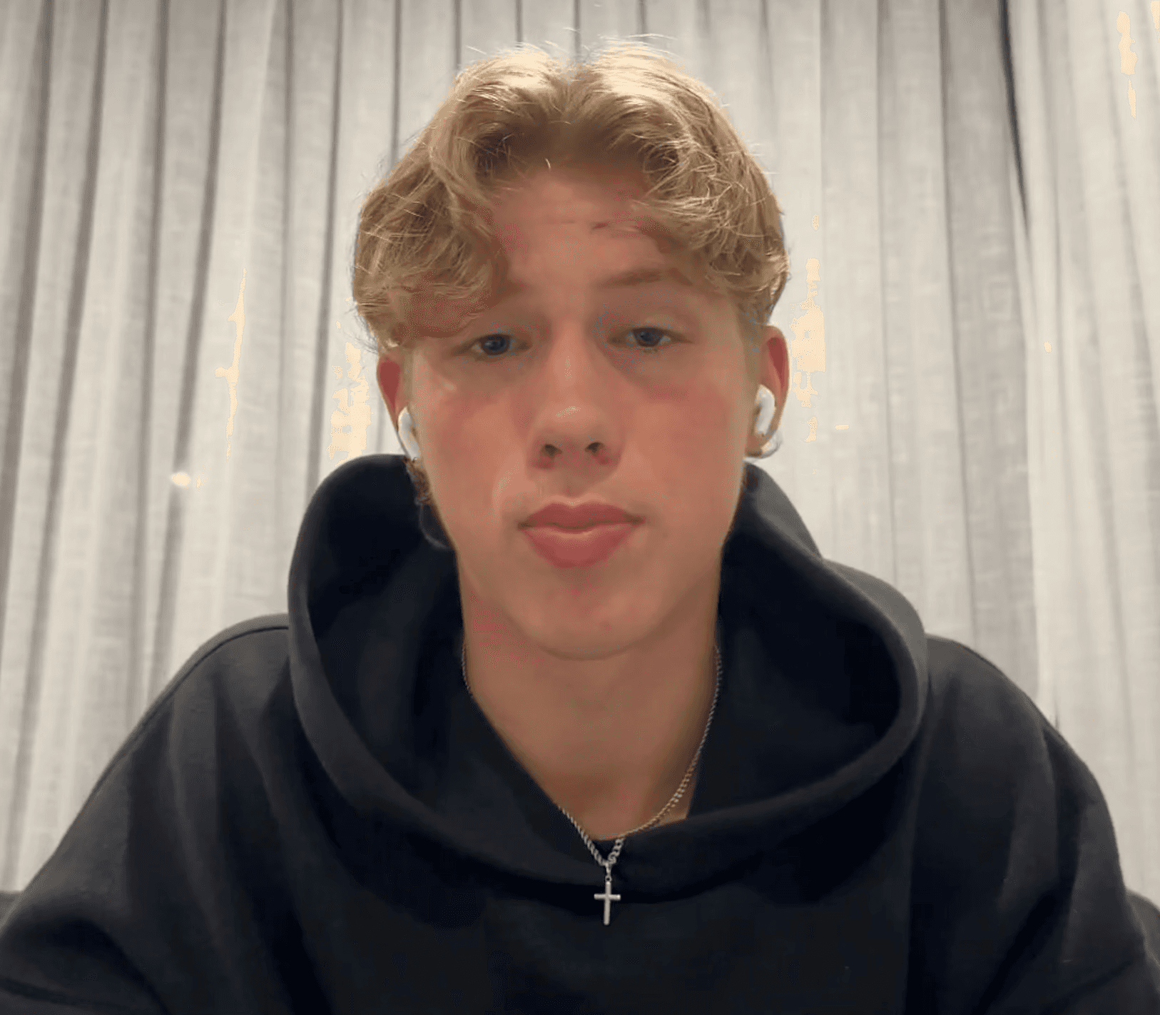 man standing beside wall