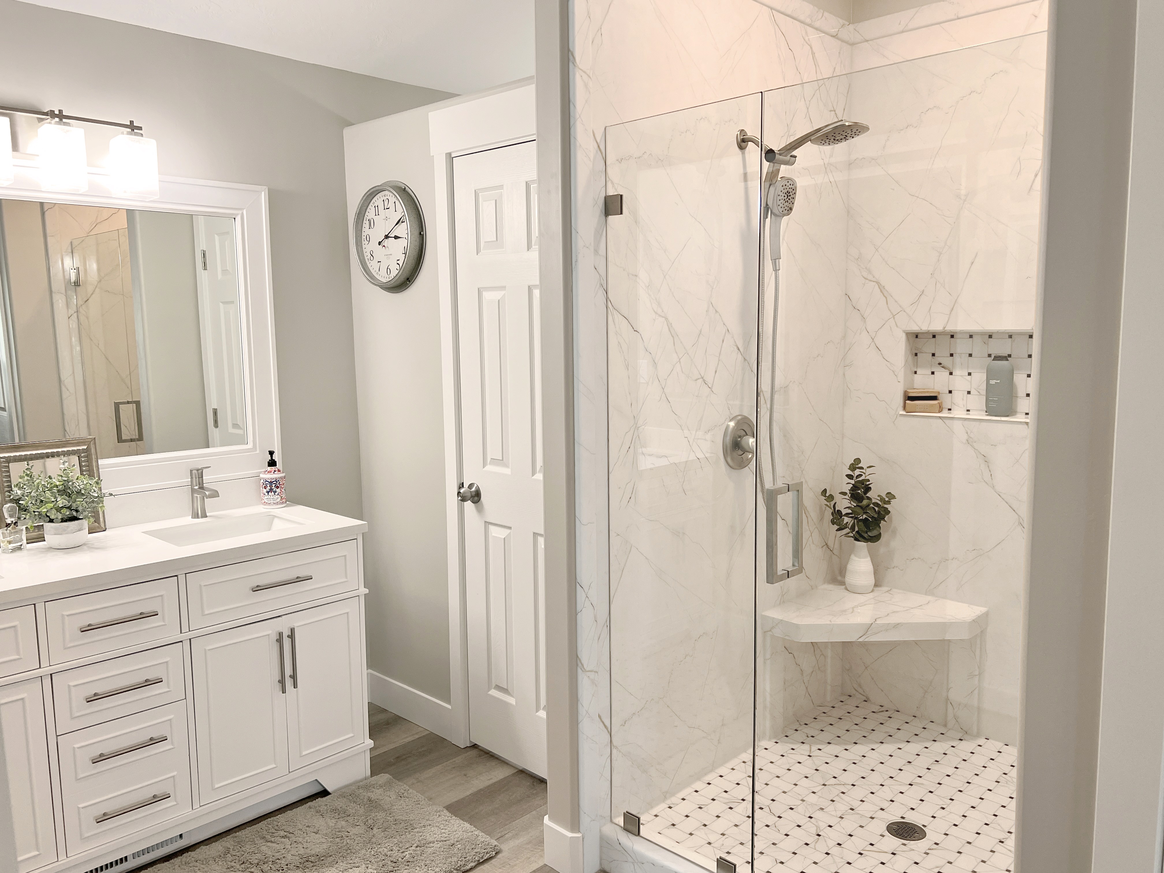 Modern bathroom remodel with walk in shower and vanity