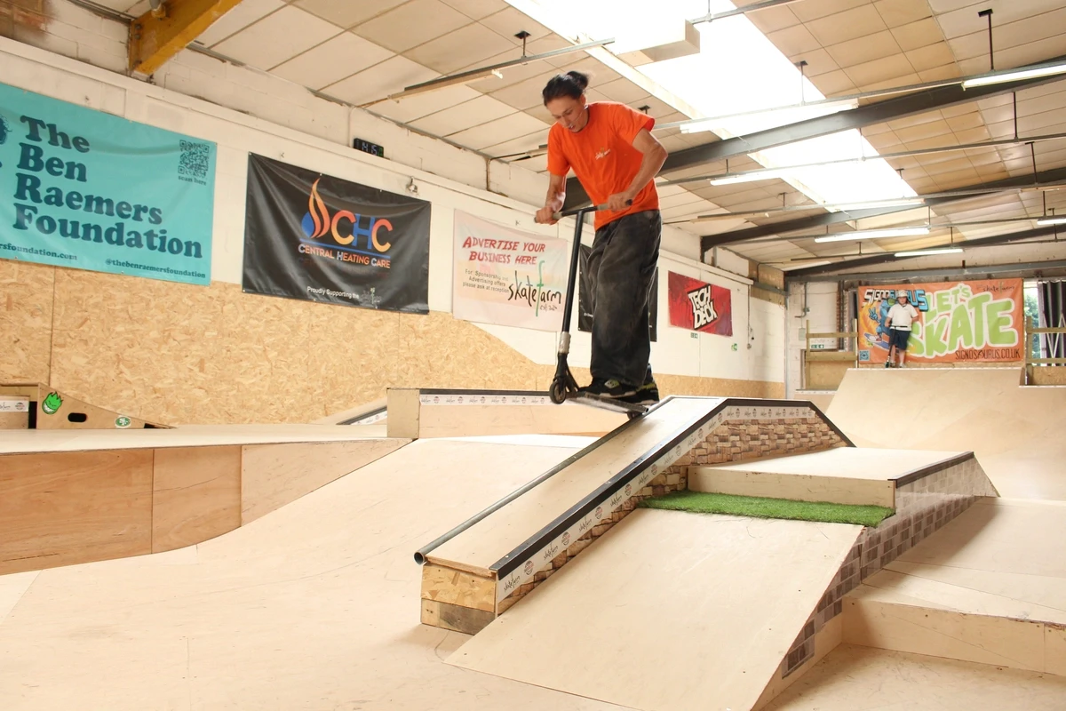 A scooter rider on the ramp at The Skate Farm indoor skatepark in Haywards Heath