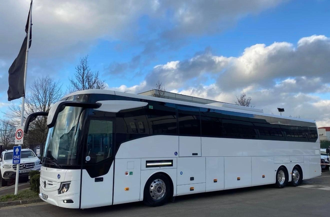 Luxury coach and minibus fleet used for city tours and private transfers, showcasing premium travel services and modern design in urban and scenic environments