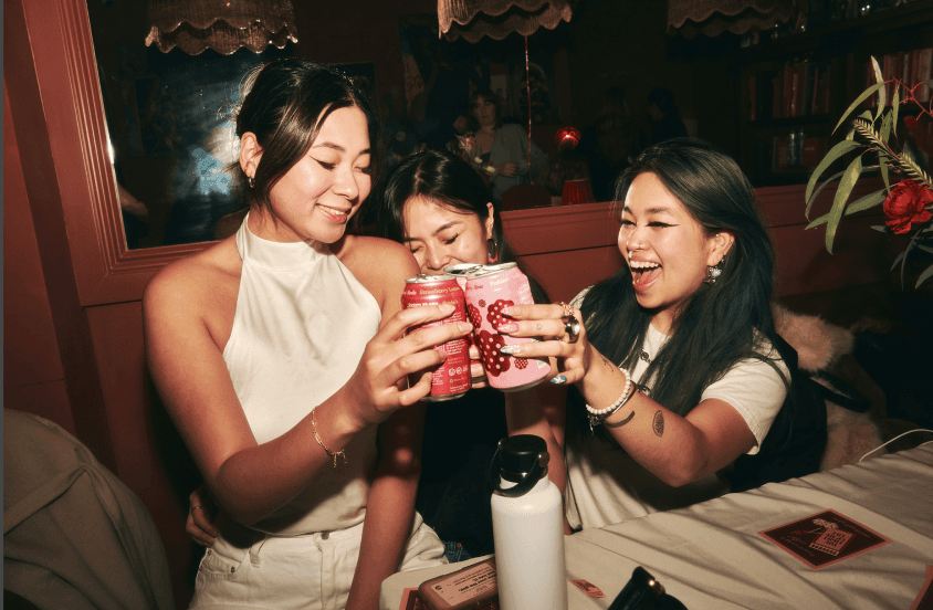 Guests at singles event playing icebreaker game during IRL dating night