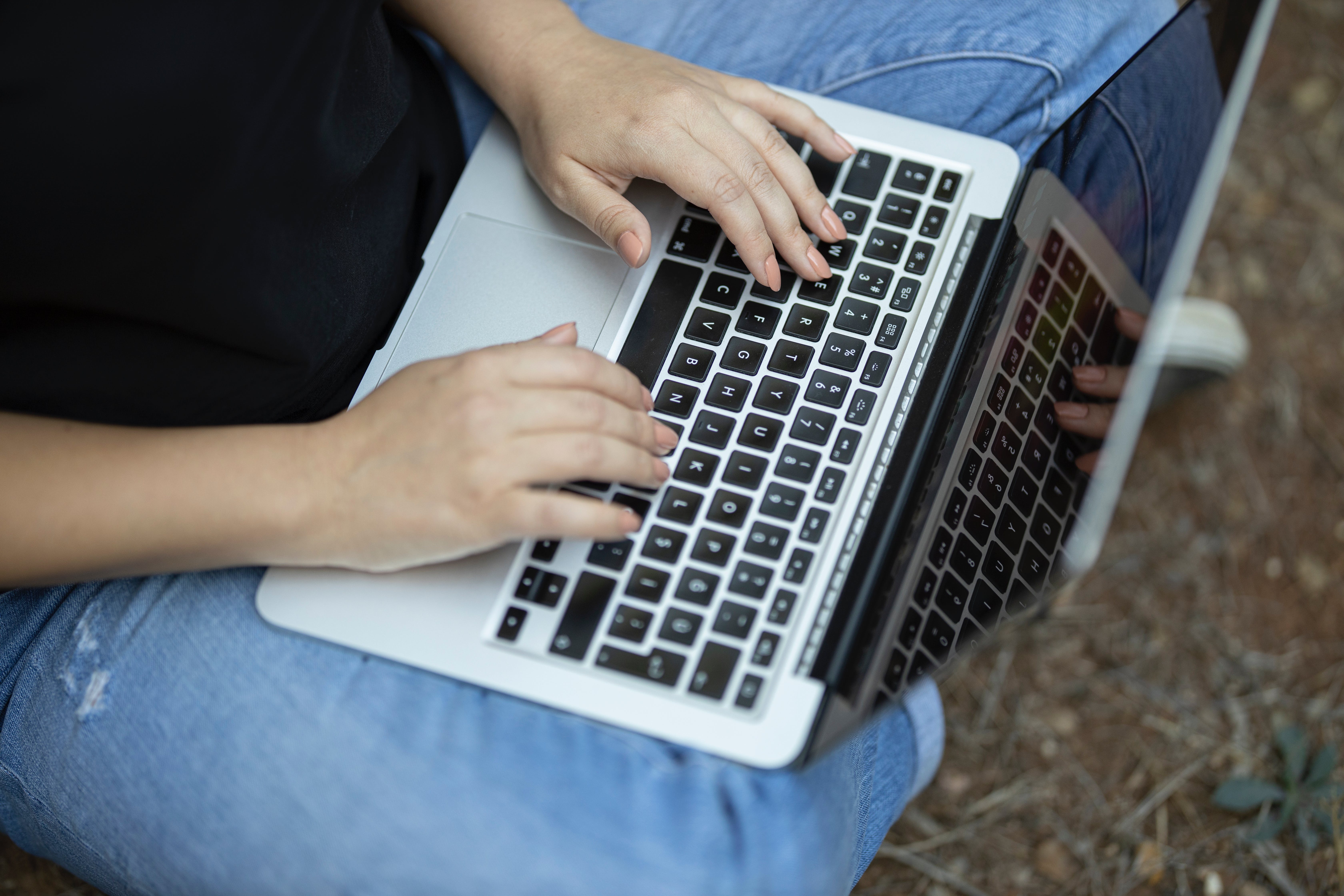 Woman stopping unwanted emails on laptop