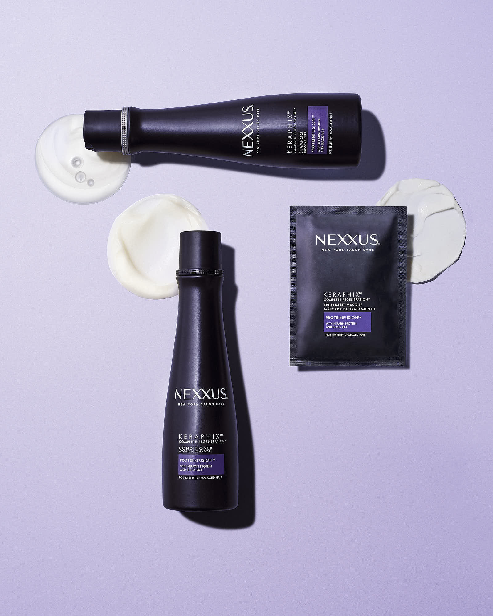 Three hair care products with black packaging arranged on a light purple background.