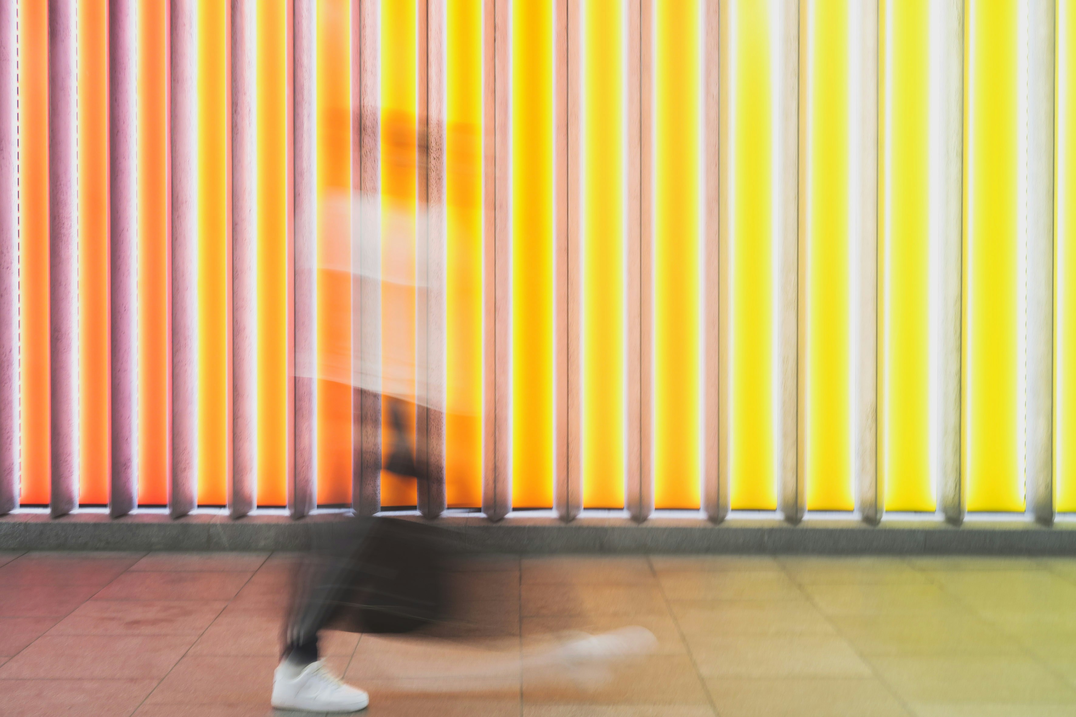 woman-walking-lights-colorful-design-color-blur