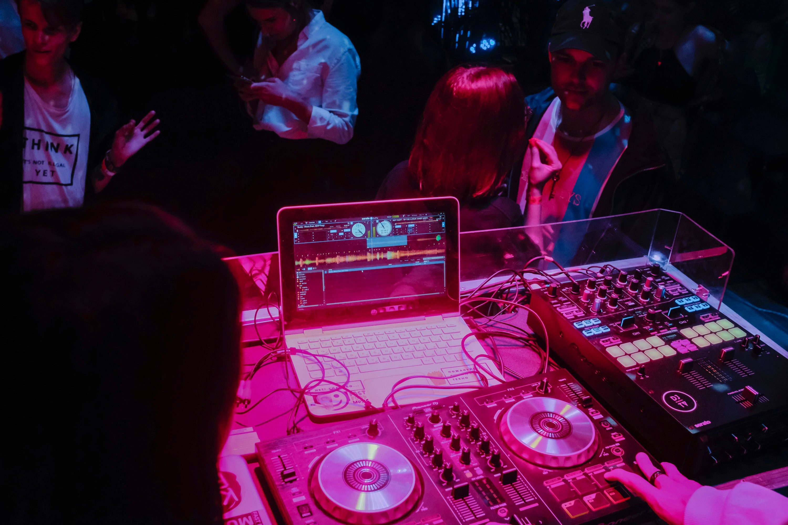 laptop playing songs of ai music artist
