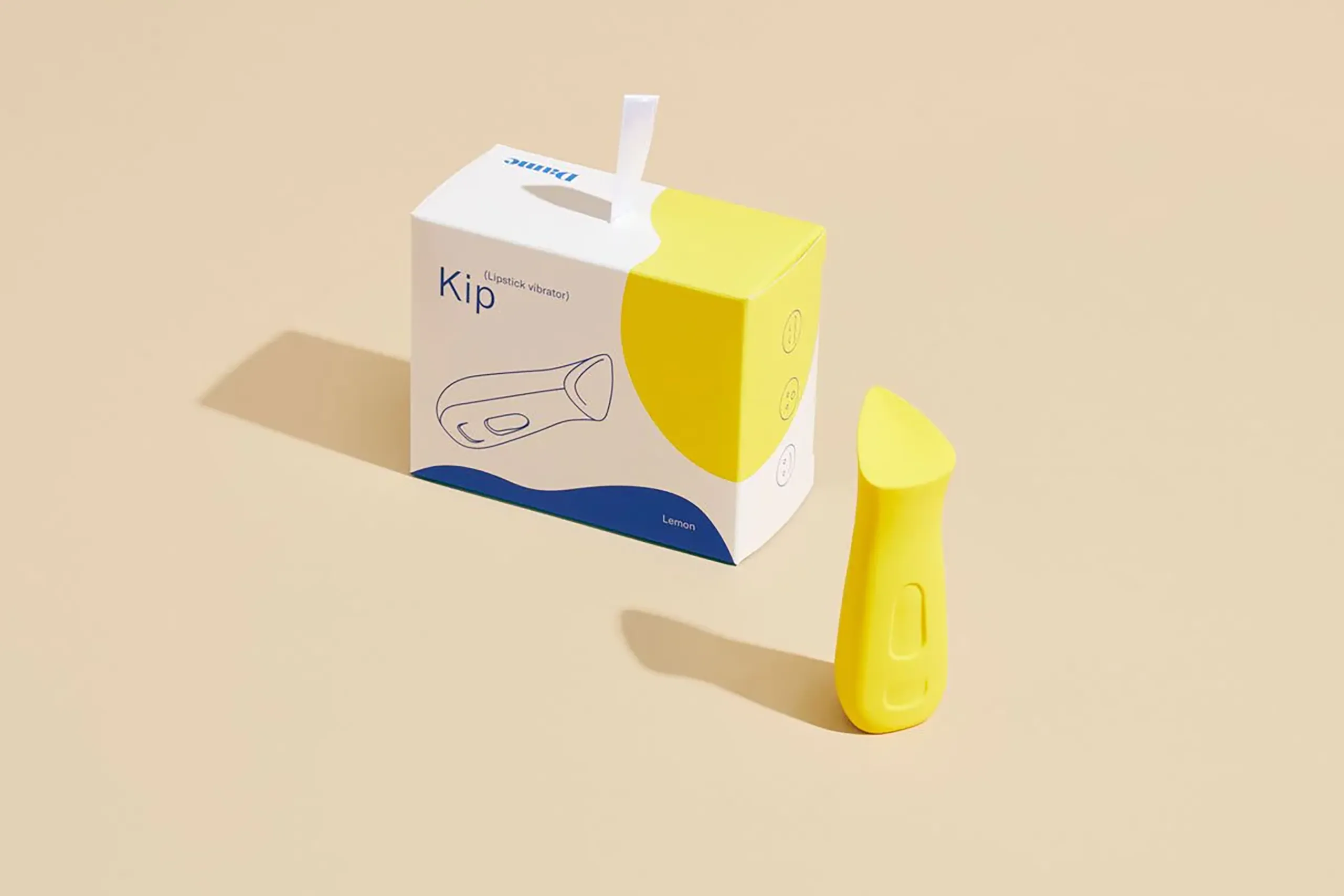 Yellow Kip sexual wellness device shown upright on a white background