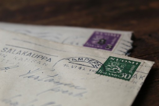white printer paper in an enveloppe, illustrating the administrative address