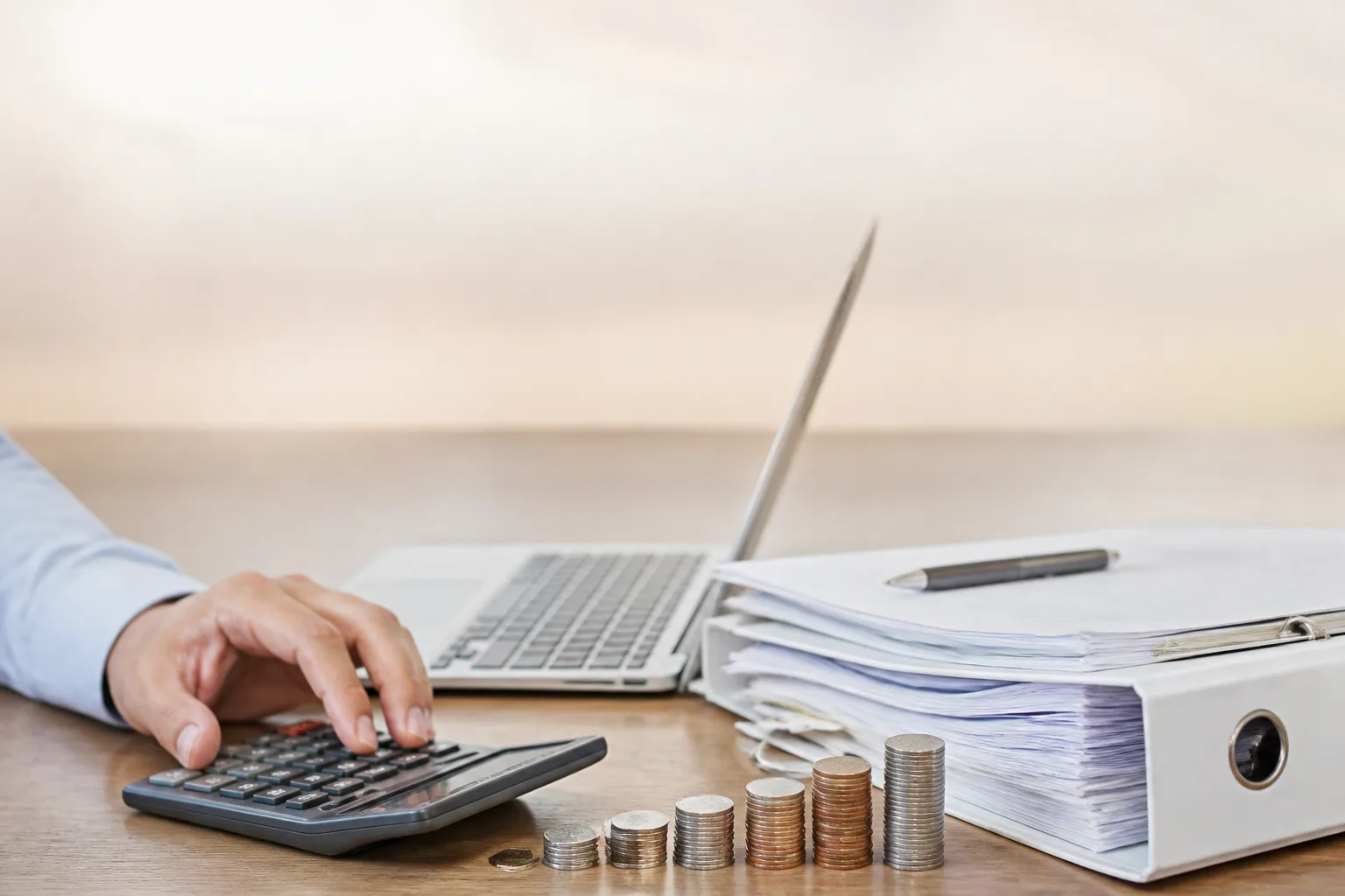 Bookkeeping Cost for a Small Dubai Company beside a tax filing dashboard and a document