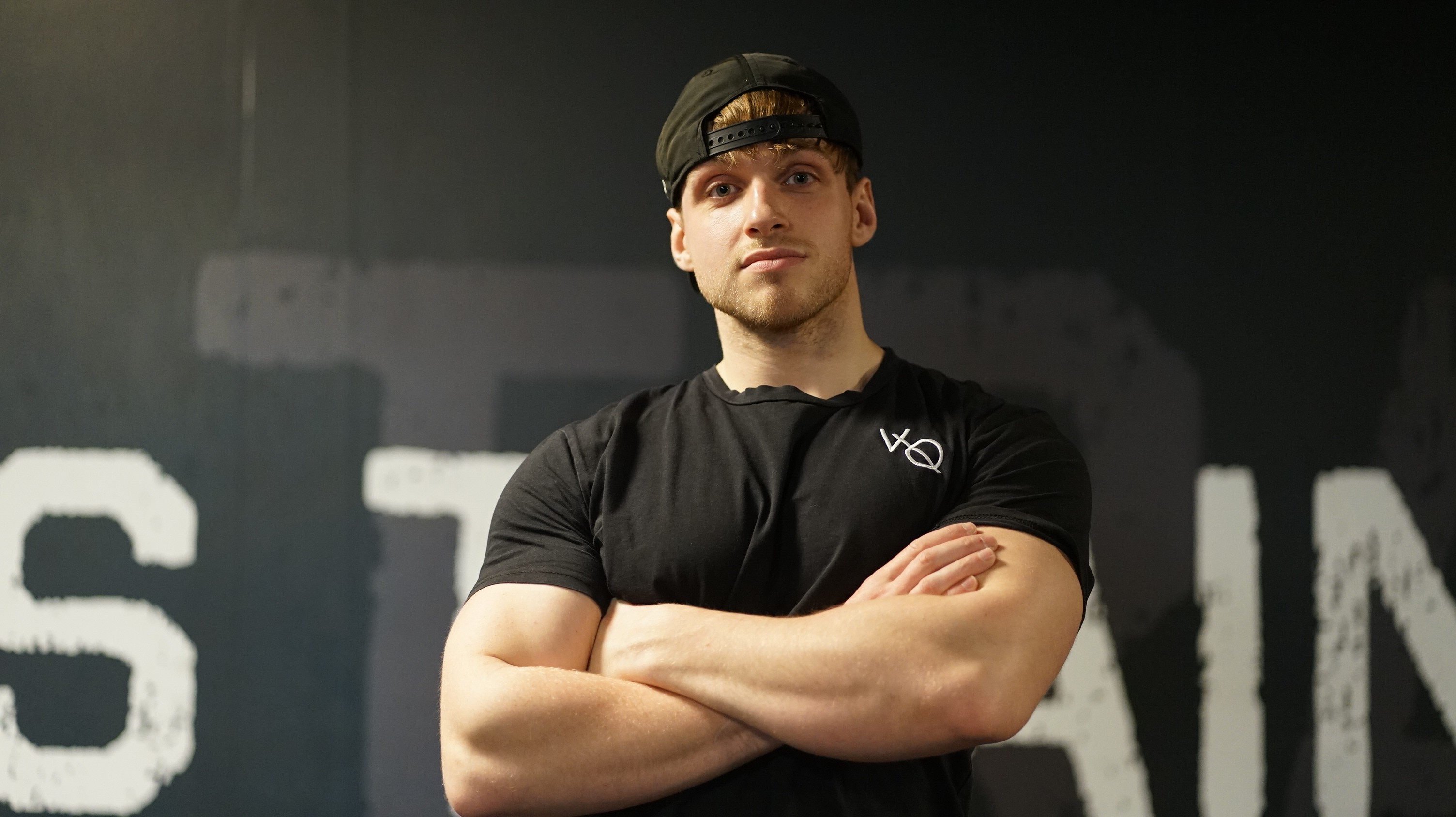 woman in black tank top and red shorts doing exercise
