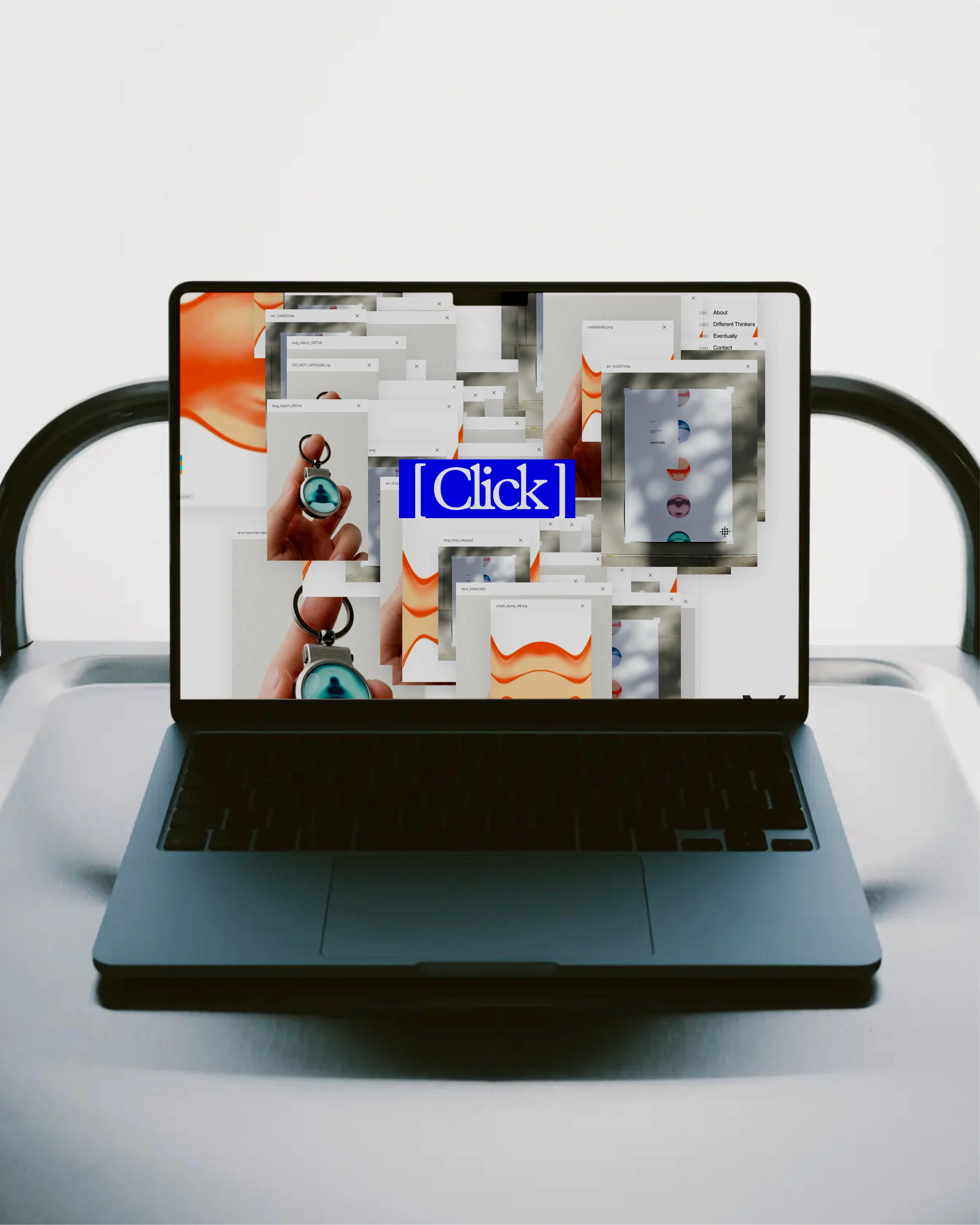 Laptop on a chair showing a Different Thinking web page with a blue Click button