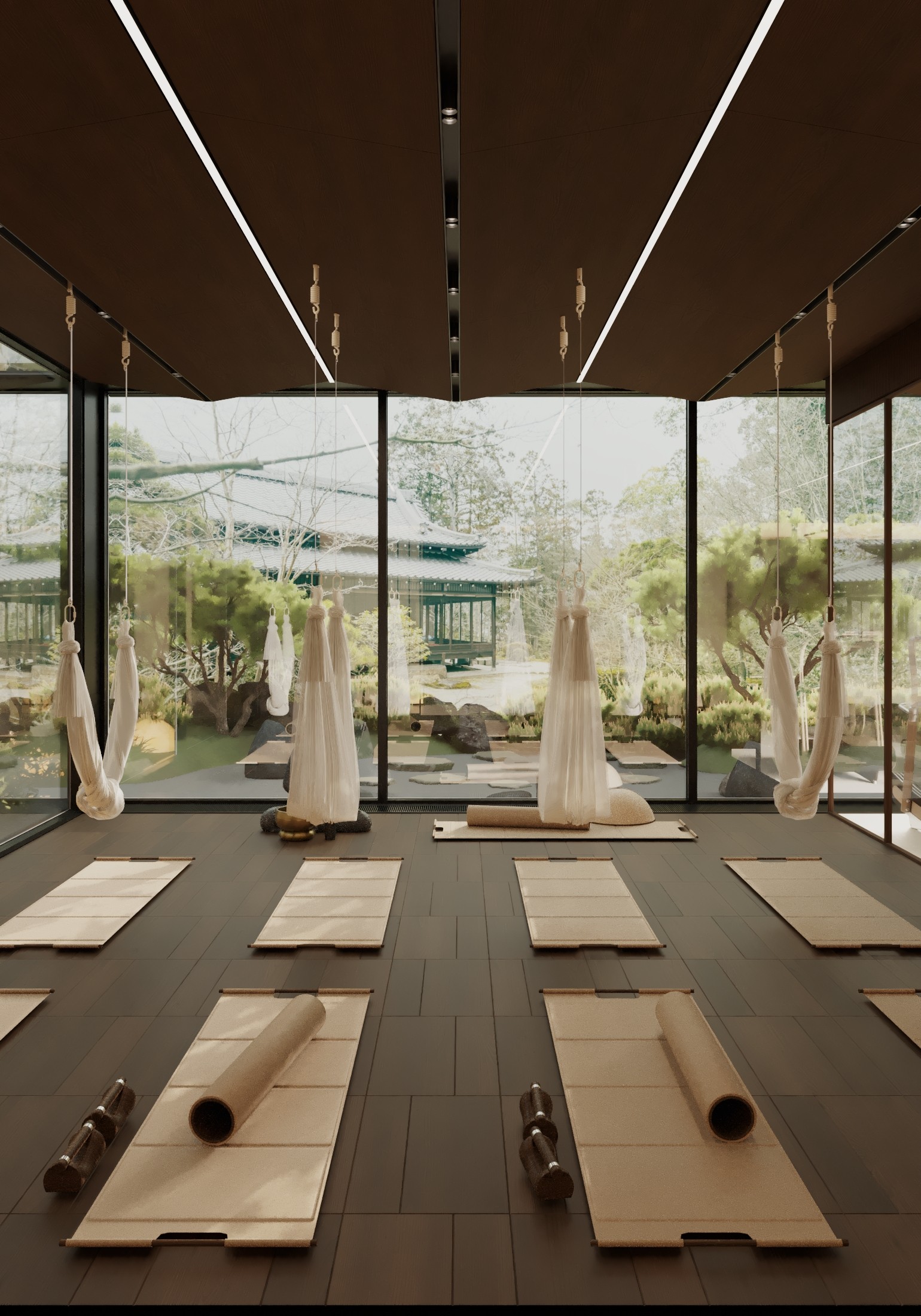 A serene yoga studio with mats arranged neatly, large windows showing a green landscape outside.