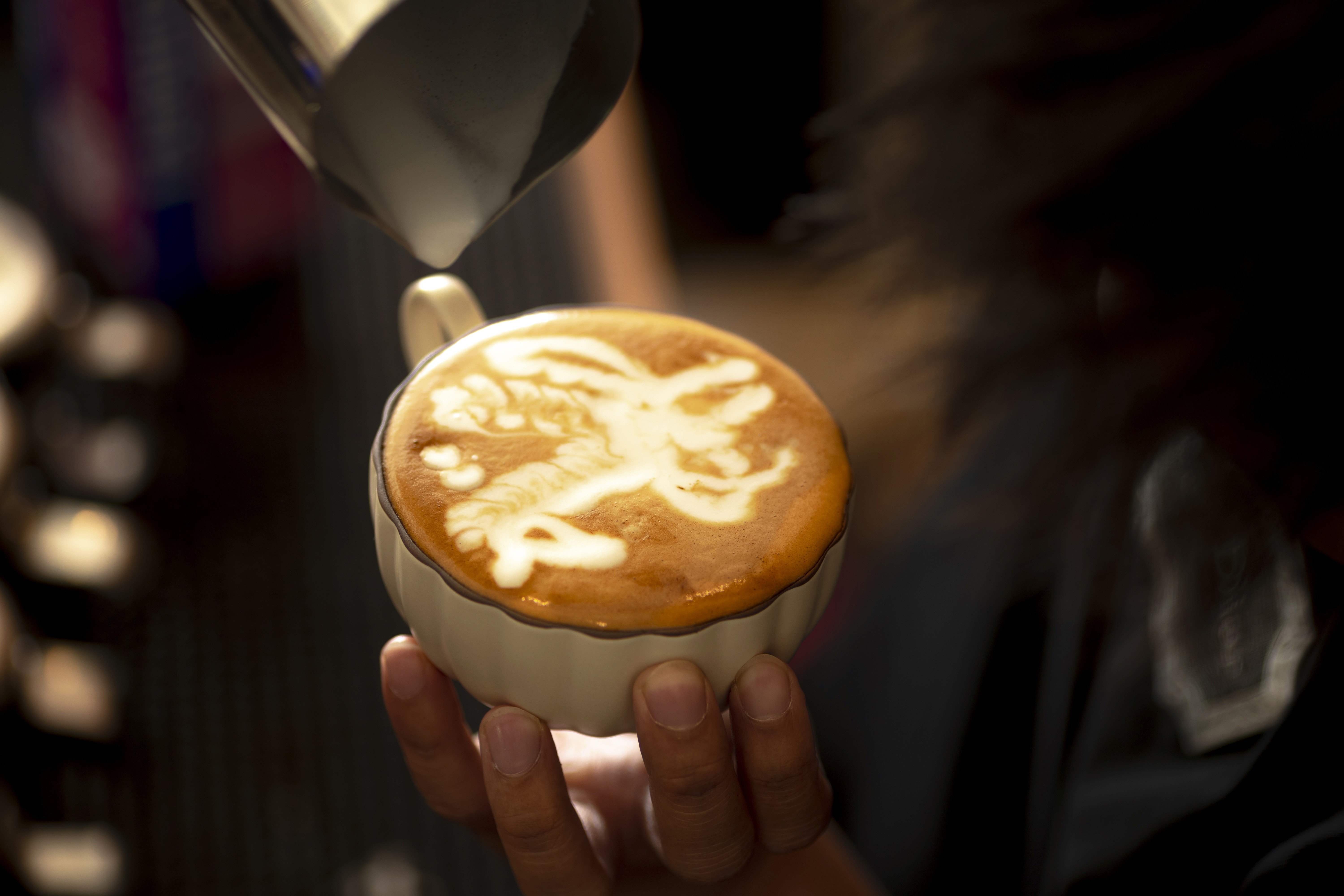cappuccino in background with plant
