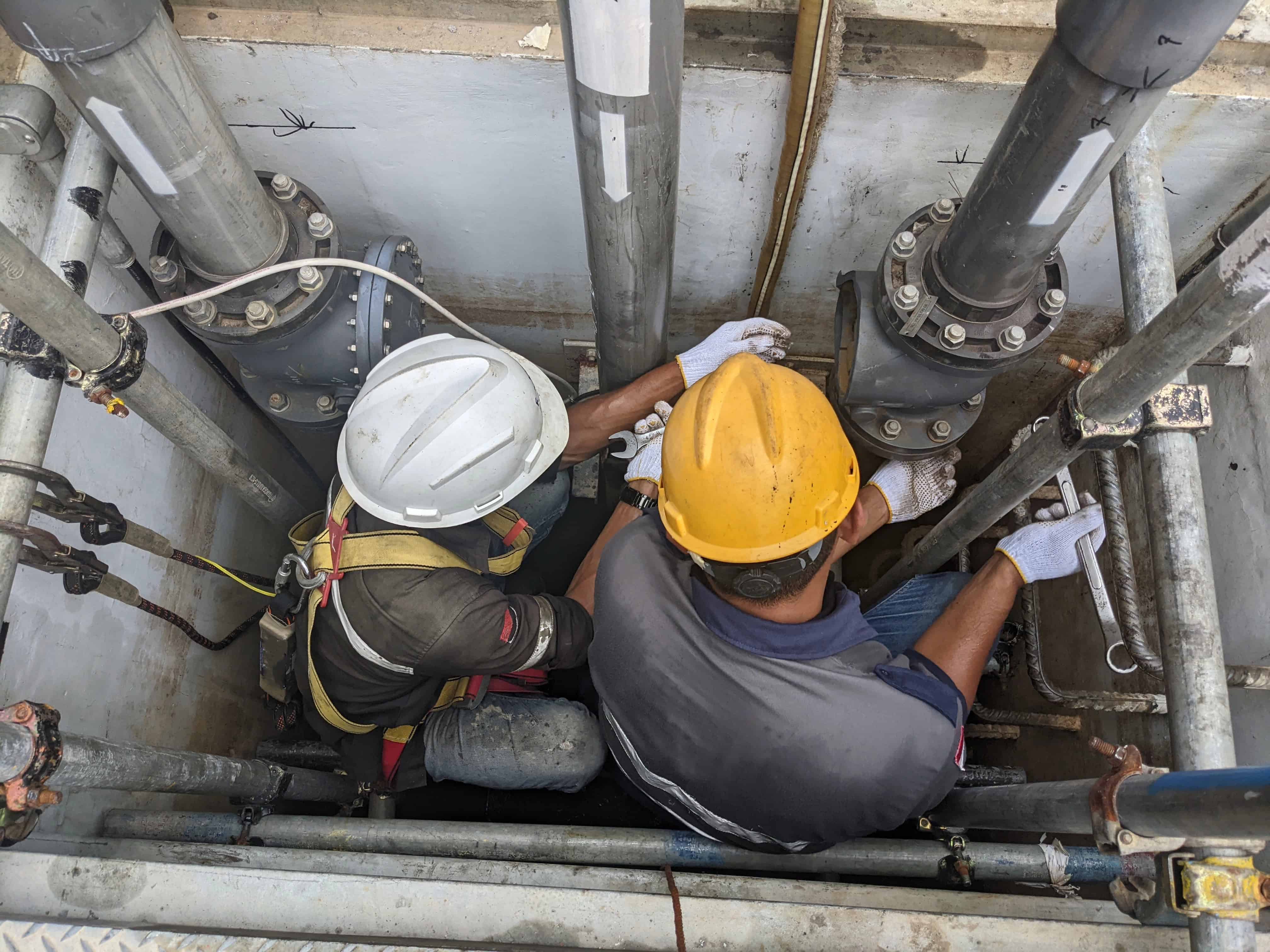 Utility workers in a restricted work area using HOP tools to ensure work is performed correctly the first time