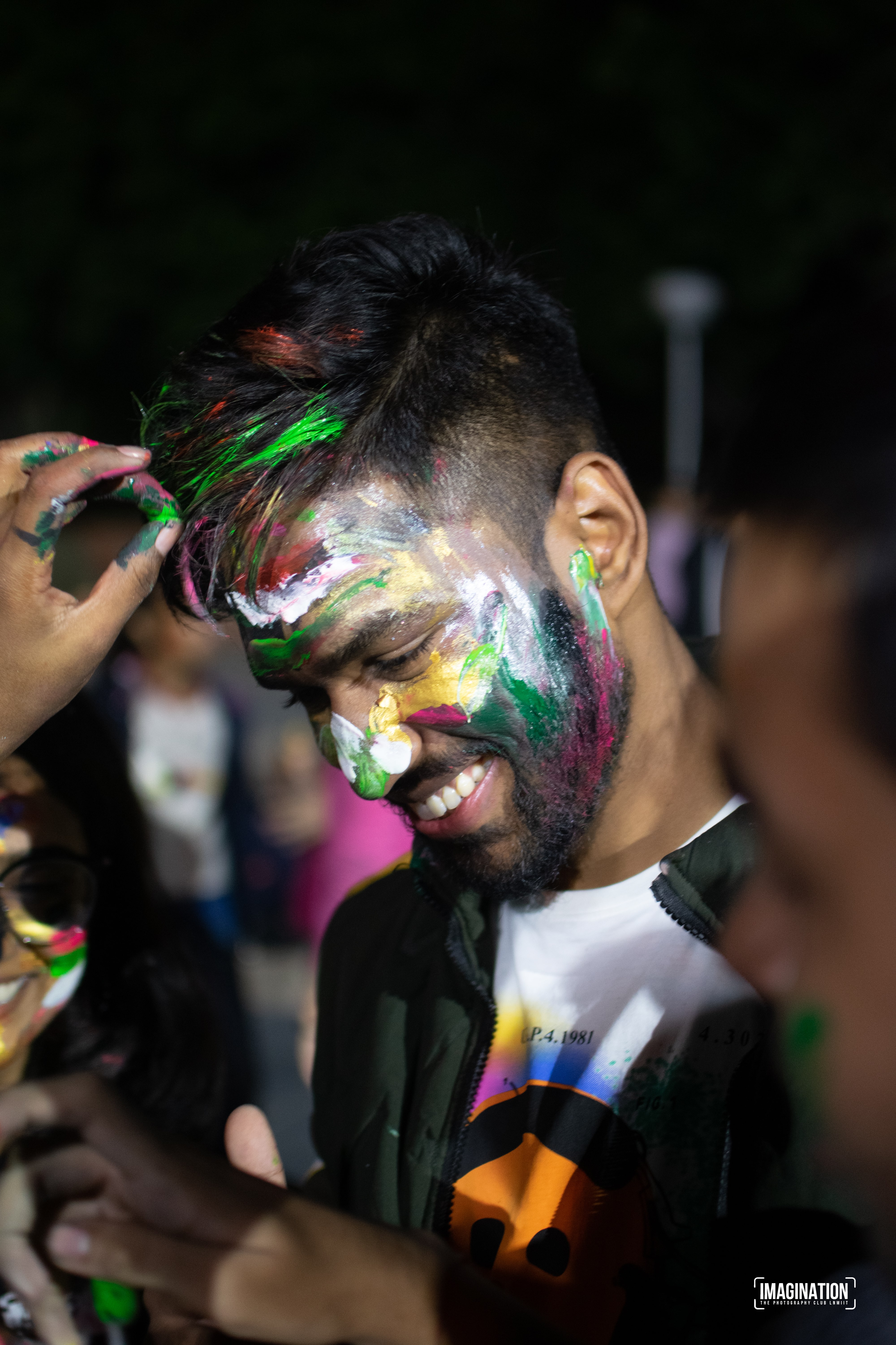 Peace Badejo, wearing sunglasses, looking to the left.