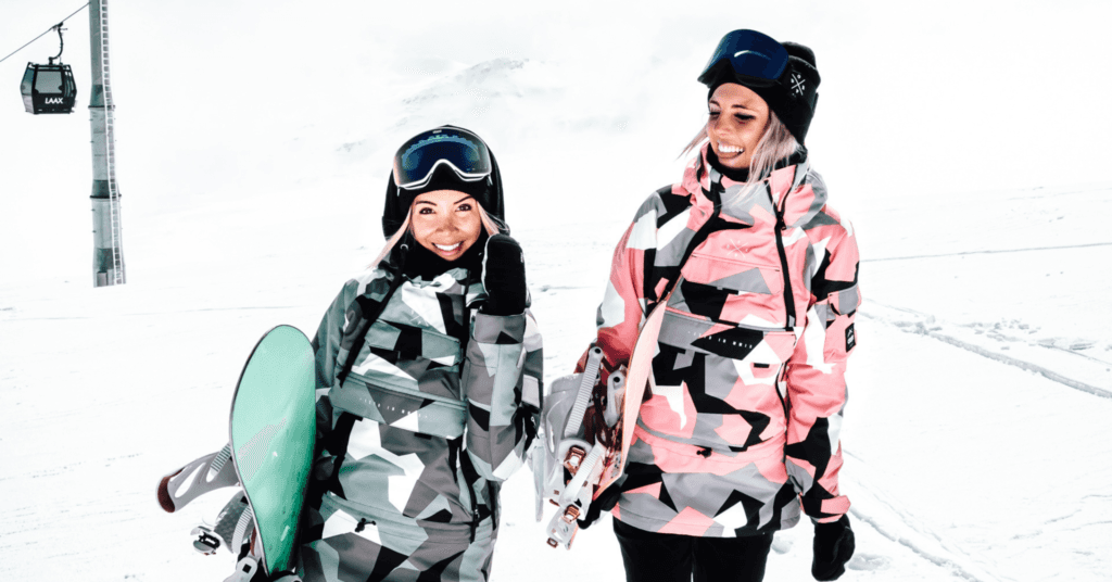 Two women wearing Dopesnow ski jackets