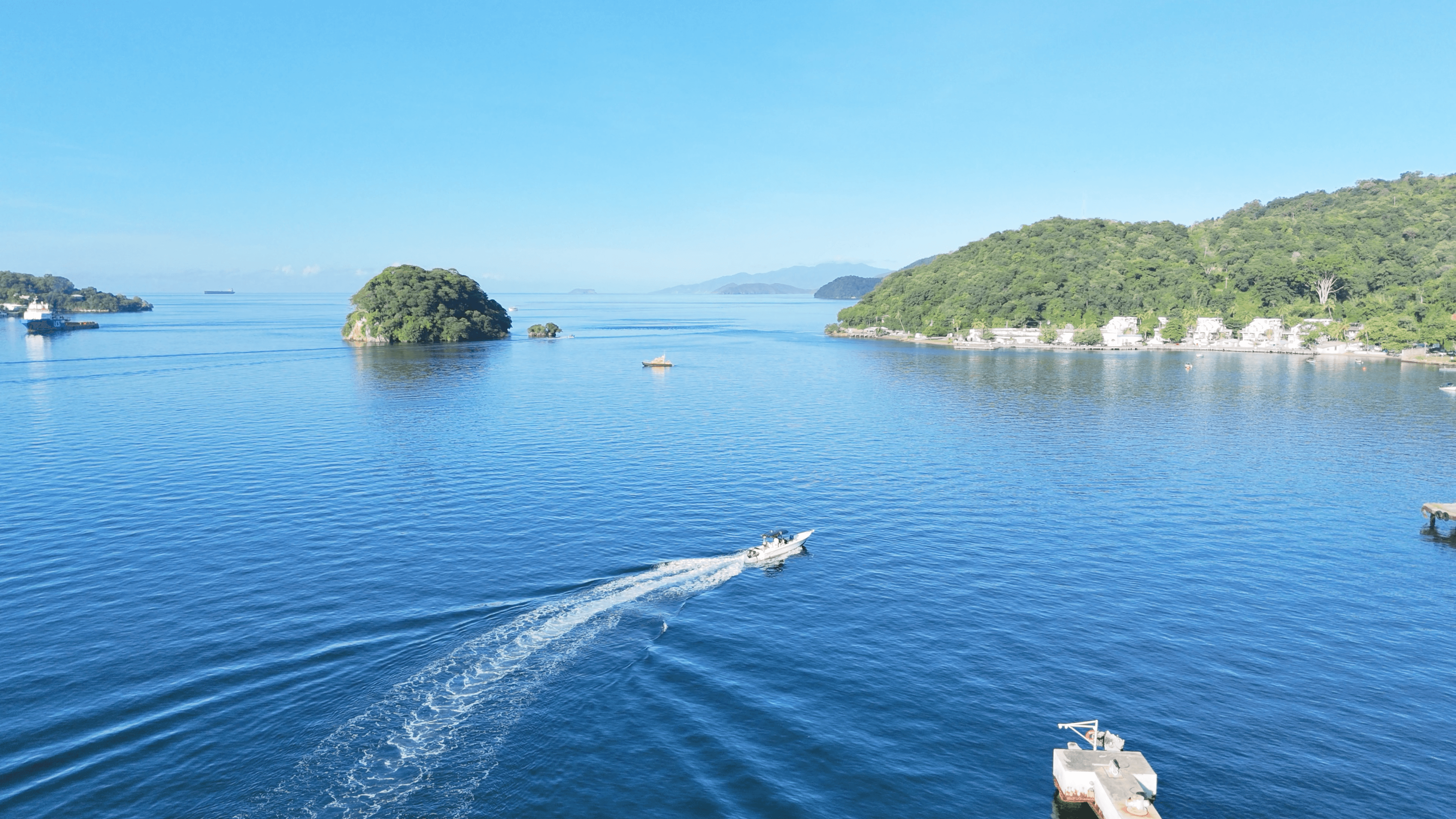 Aerial view of boat driving in water