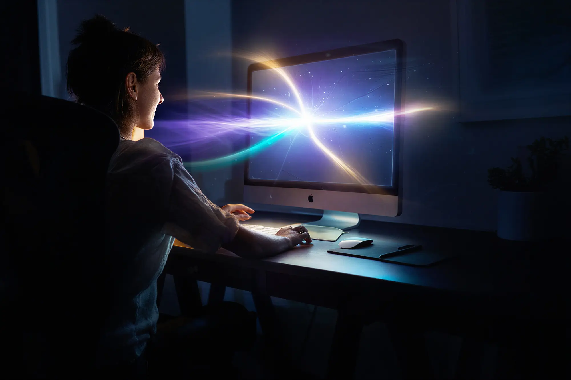 Woman in front of iMac working remotely from home office, with abstract rays of light representing ISP bonding