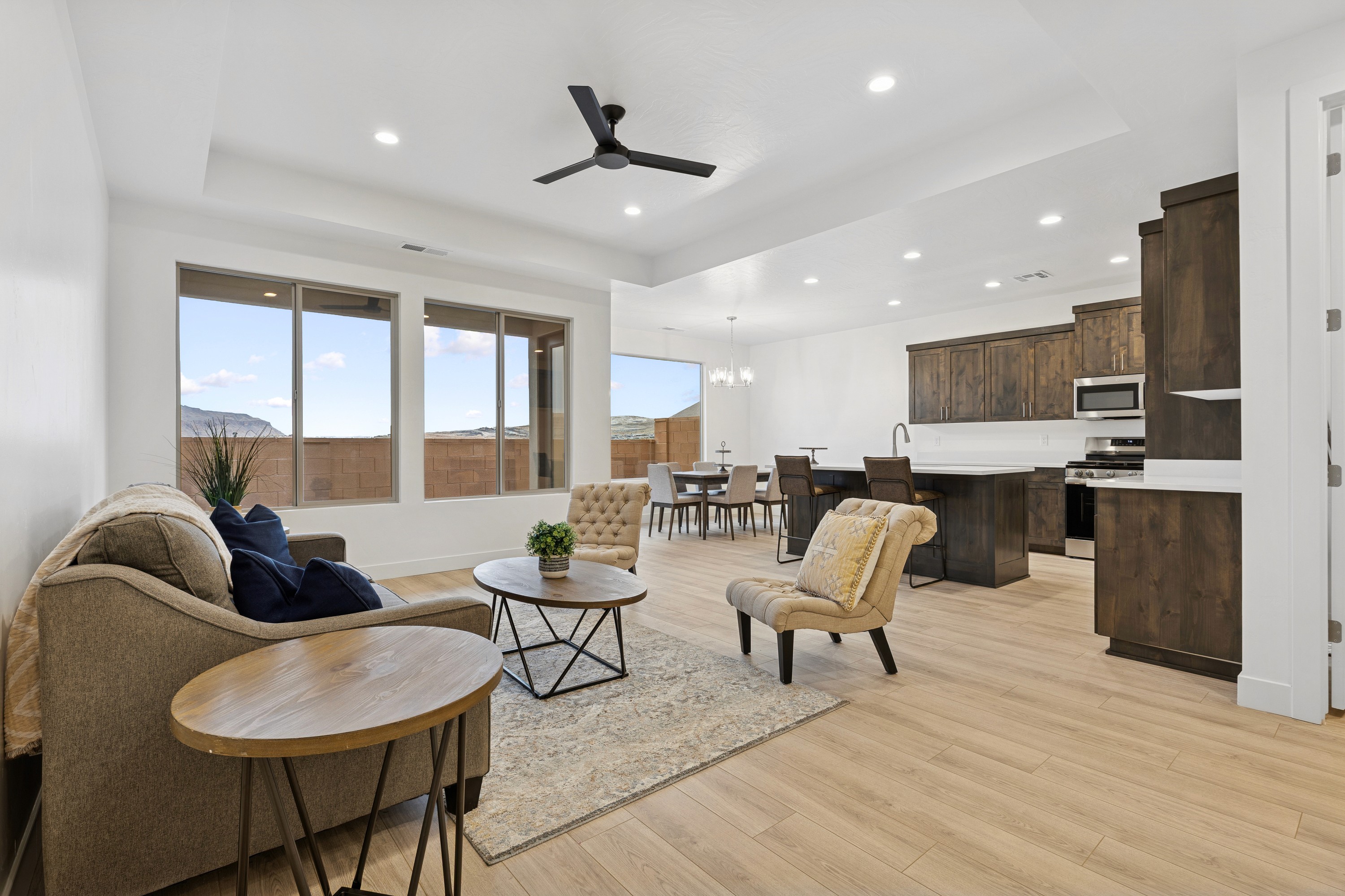 Living room looking toward the kitchen in The High Desert Home in Hurricane Utah with open concept design.
