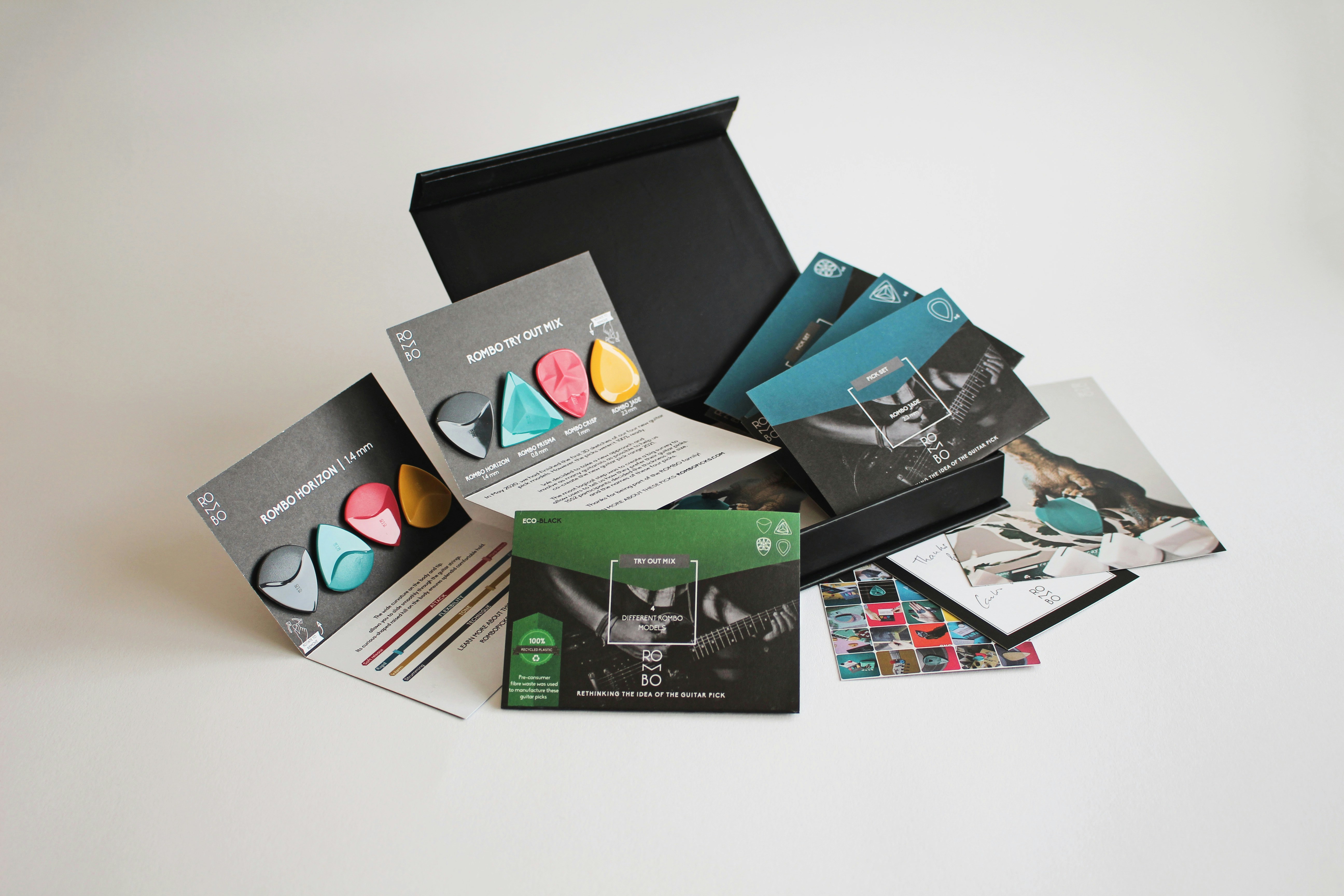 black and green labeled flyer for guitar picks samples