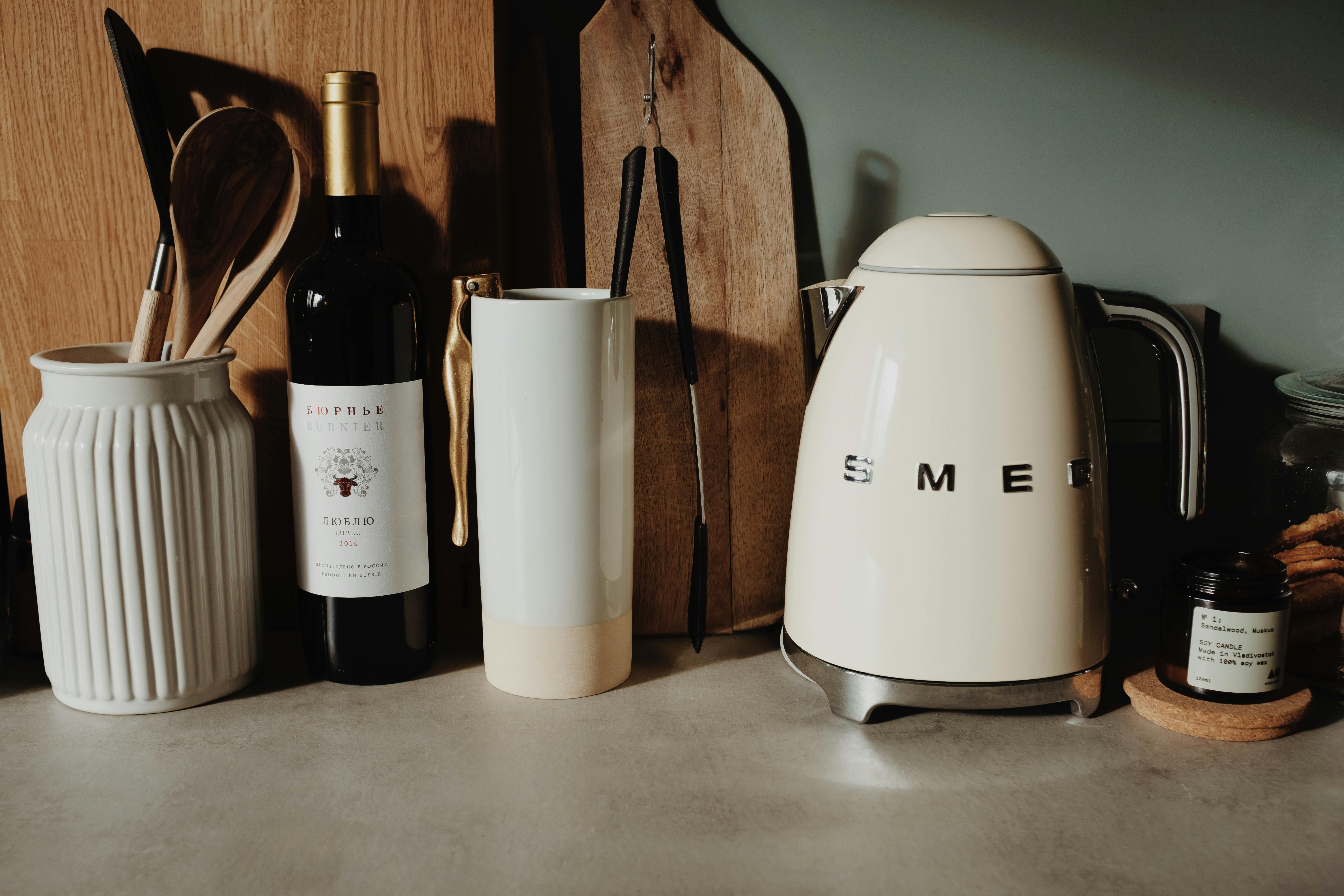 a-modern-kitchen-setup-featuring-a-smeg-kettle,-wine-bottle,-and-utensils-for-a- - ready-made (pexels)