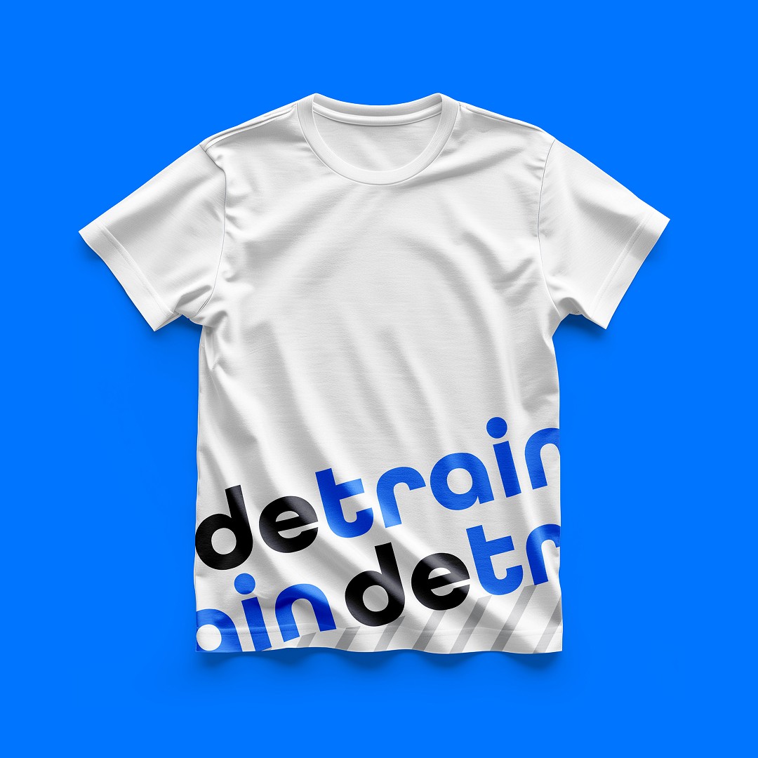 Modern home office setup with a monitor, ergonomic chair, keyboard, and indoor plants near a window with blinds.