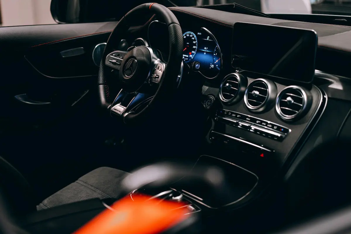 image of a car with soap suds falling off