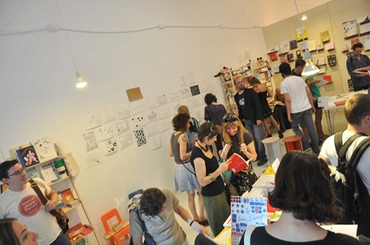 A group of people in a printing shop.