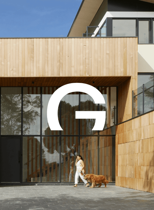 GIGA Constructions G monogram over a timber-clad building exterior