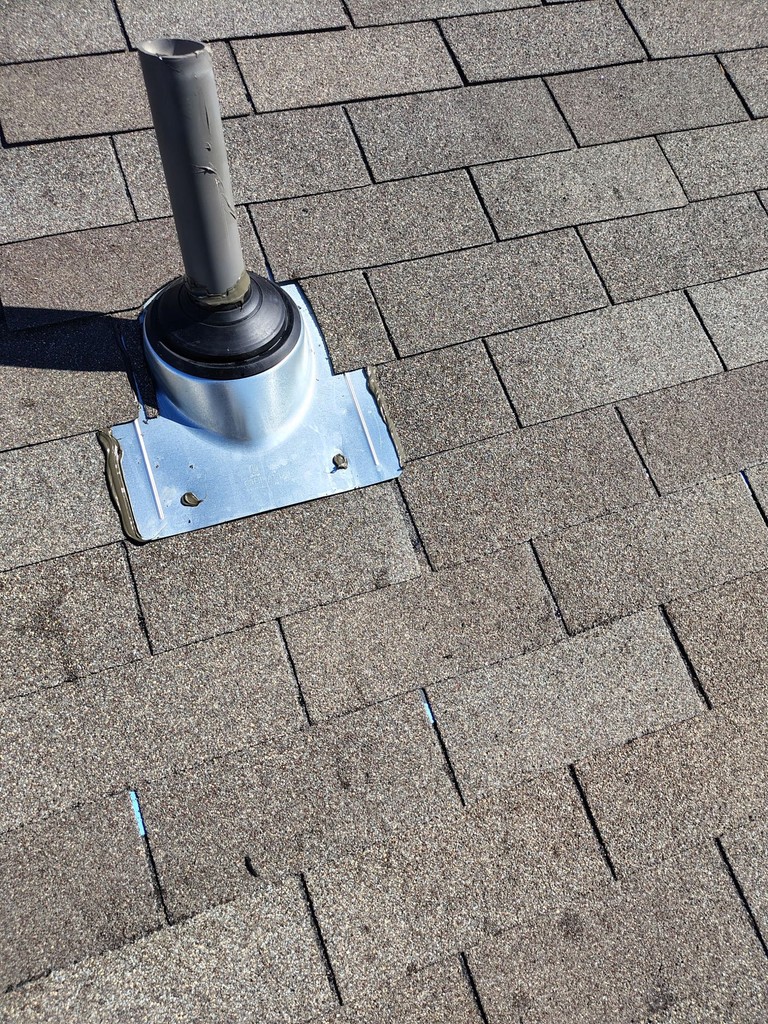 After: finished pipe flashing and surrounding shingles