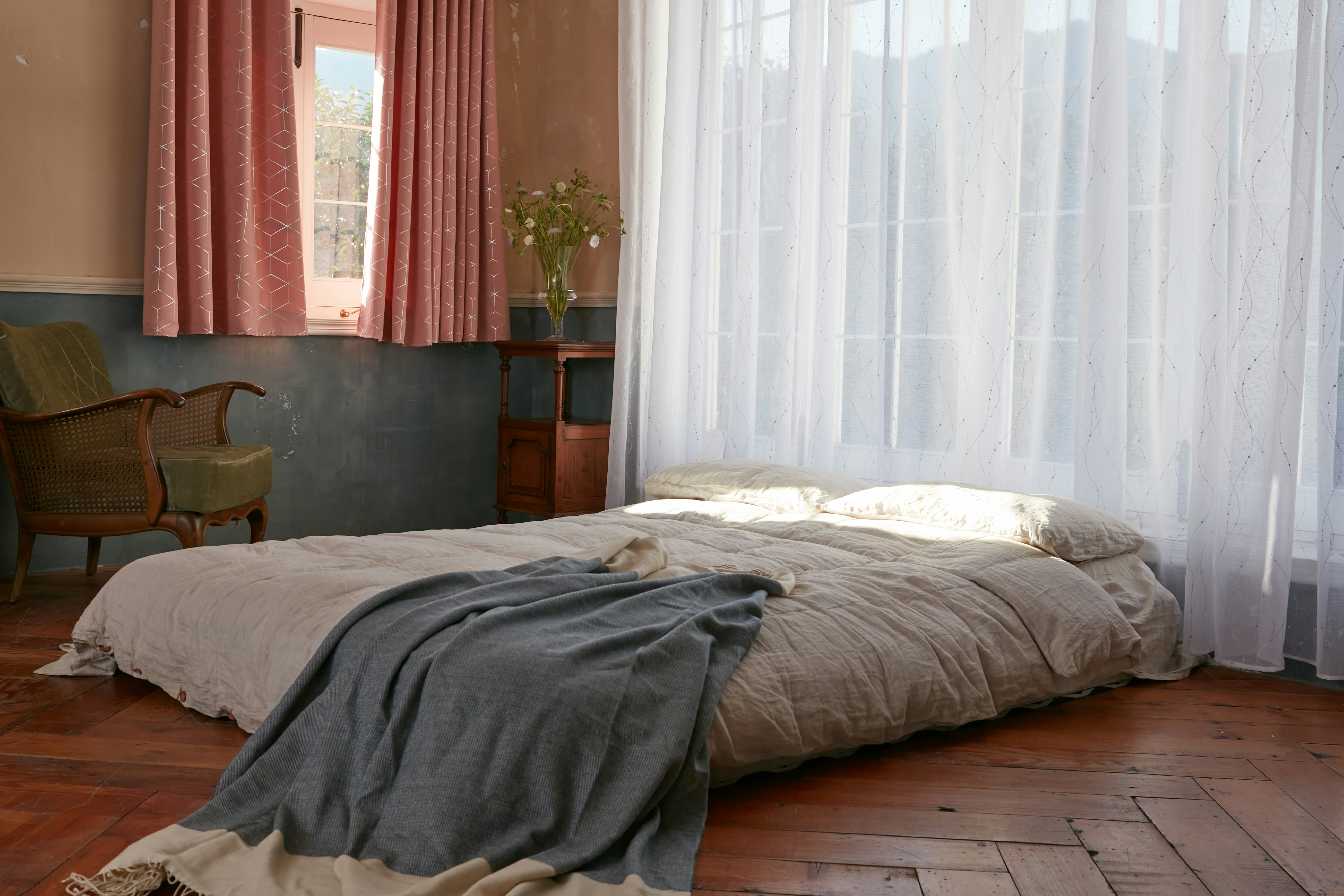 Bedroom with a comfortable bed and vintage decor.