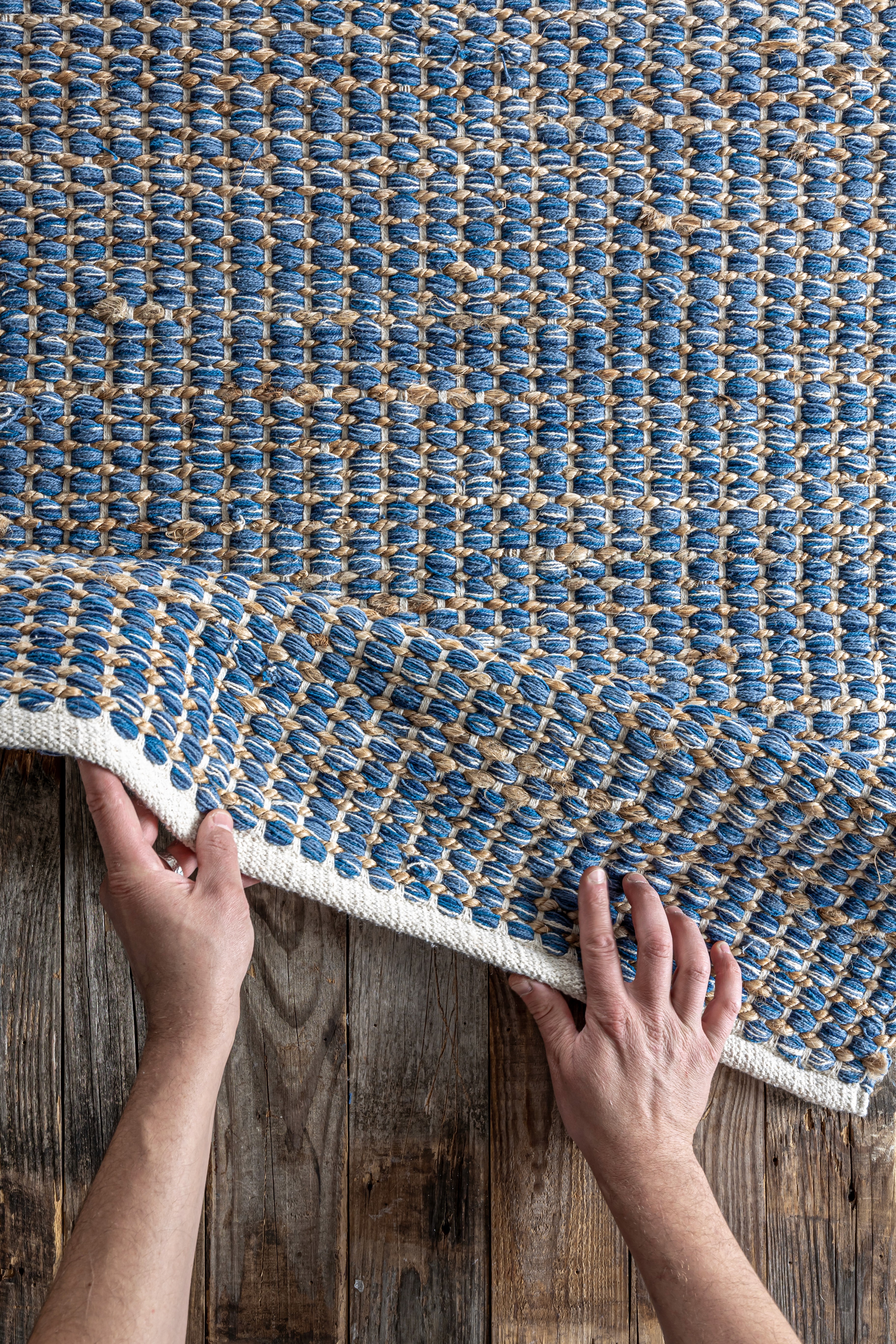 Area rug being lifted – residential carpet and rug cleaning