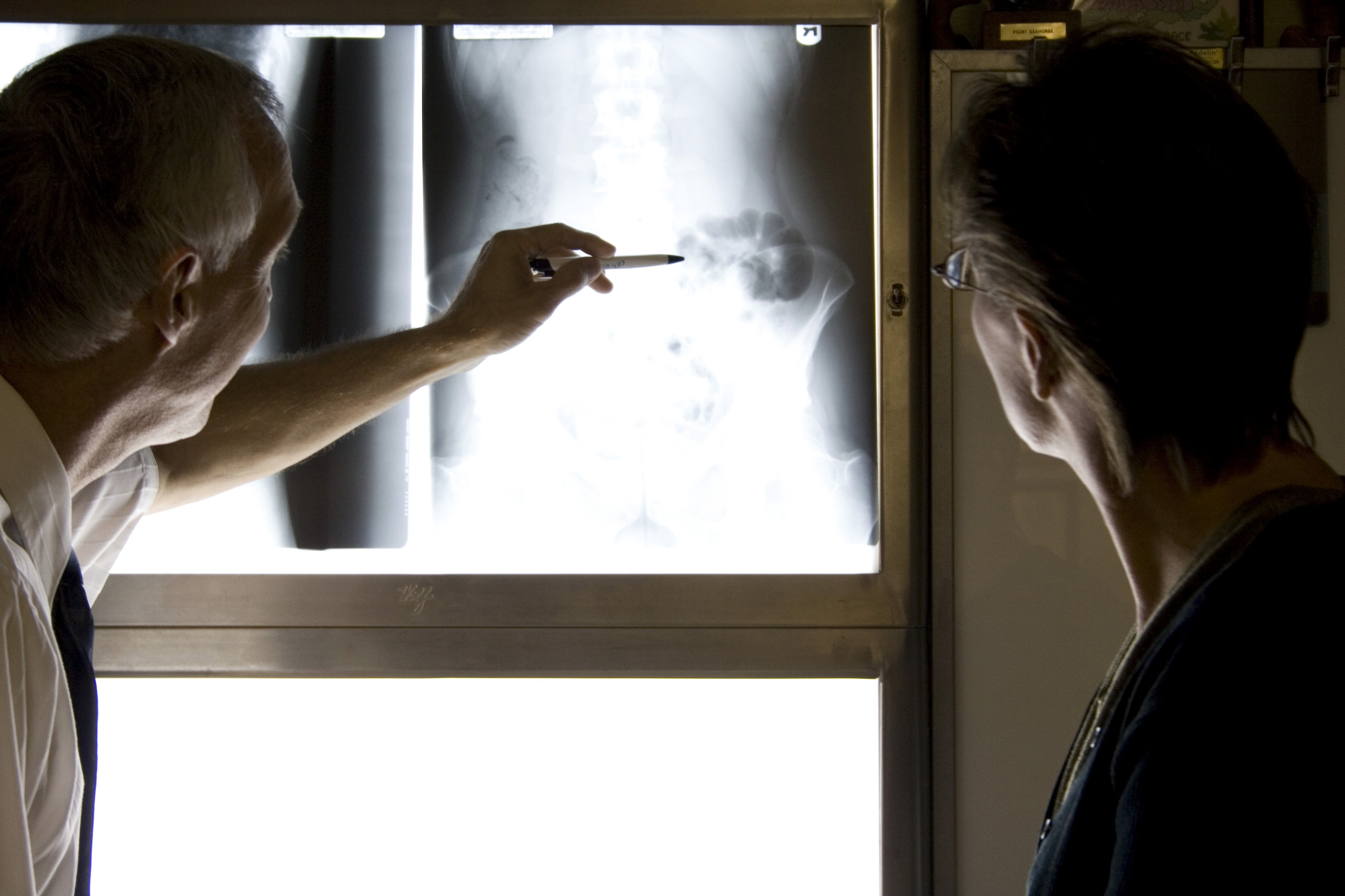 A black and white photo of a man's back