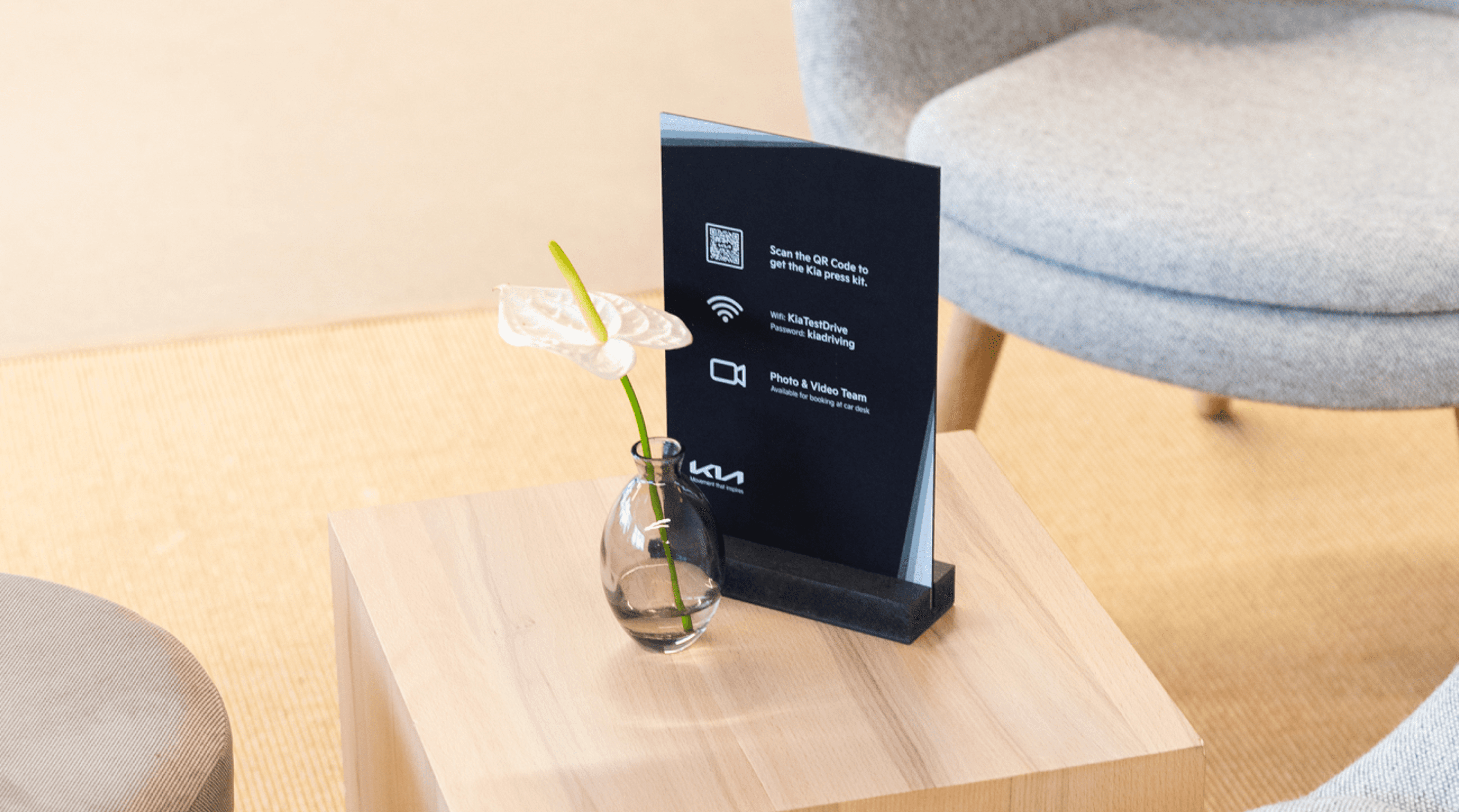 Chair with champagne and glasses by window.